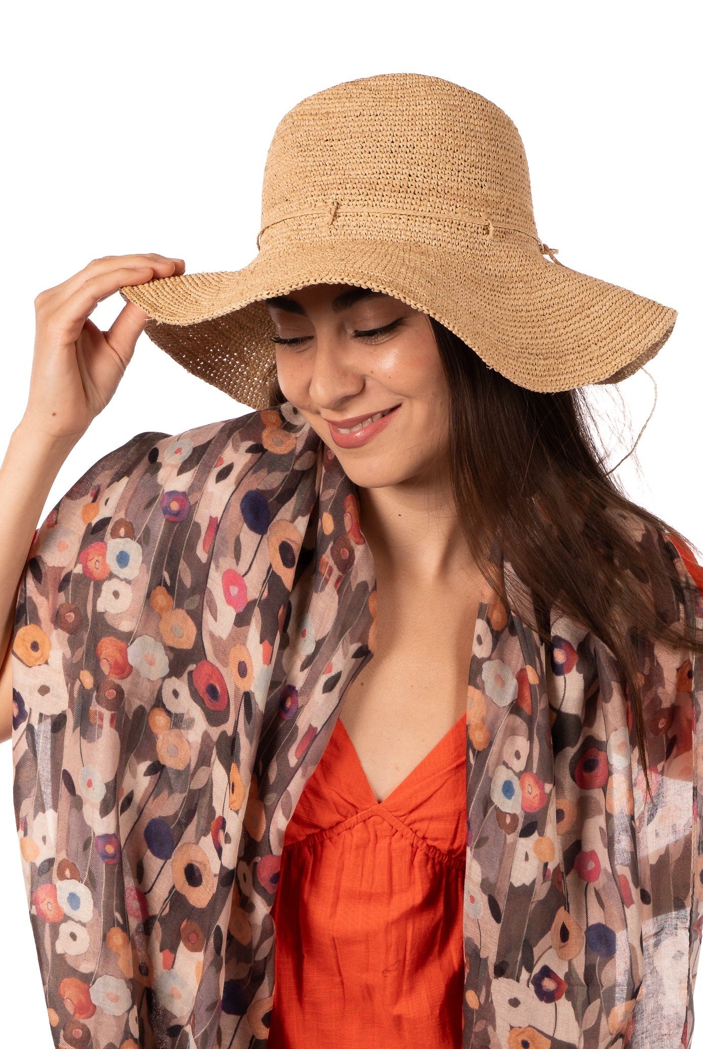 Model wearing Crochet Miramar Straw Sun Hat handmade woven raffia palm fiber in a subtle link pattered solid hue of natural straw color with matching adjustable braided hat band tie wide brim unisex panama style hat - Shebobo (with Poppy Dreams Scarf Wrap)
