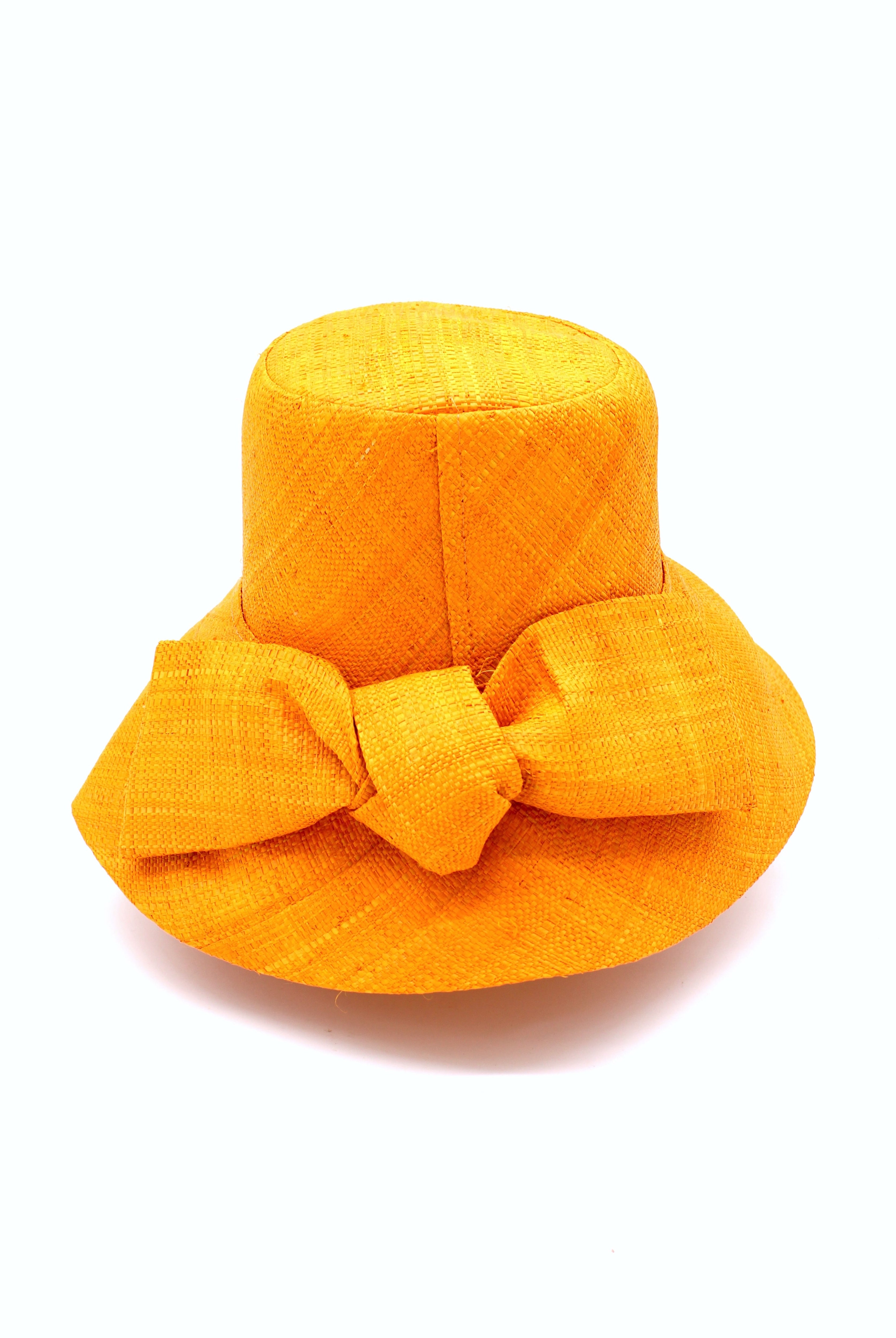 Cara Saffron big bow embellishment handmade loomed raffia in a solid hue of saffron yellow/orange straw bucket style cloche sun hat with matching oversized bow - Shebobo