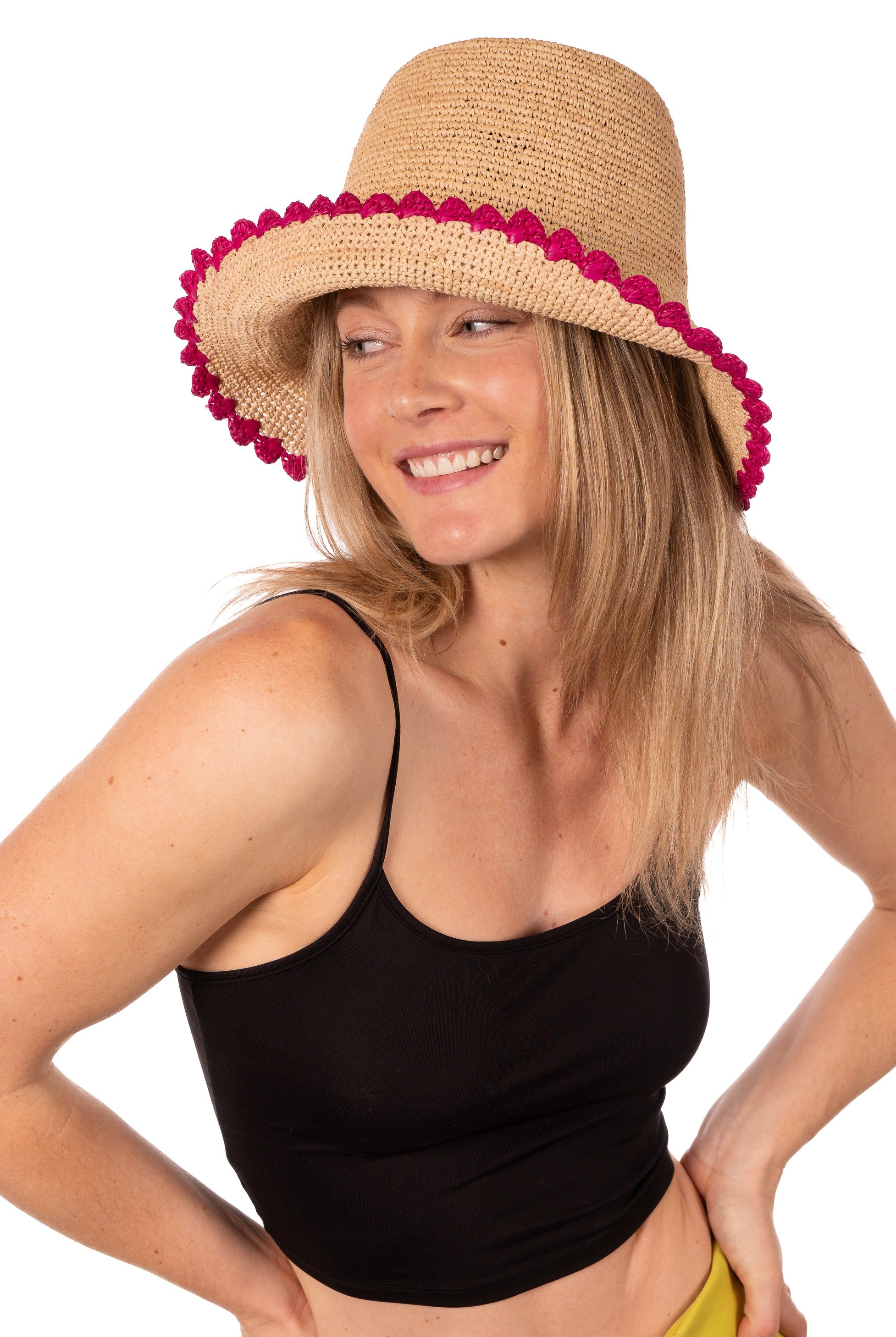 Model wearing Kate Natural with Fuchsia Crochet Bucket Straw Hats with Colored Lace Weave Edge handmade woven raffia palm fiber in a solid hue of natural straw color in a subtle link texture with fuchsia hot/bright/barbie/pink lace weave floral edge trim around the outer brim two tone multicolor uv protection hat - Shebobo