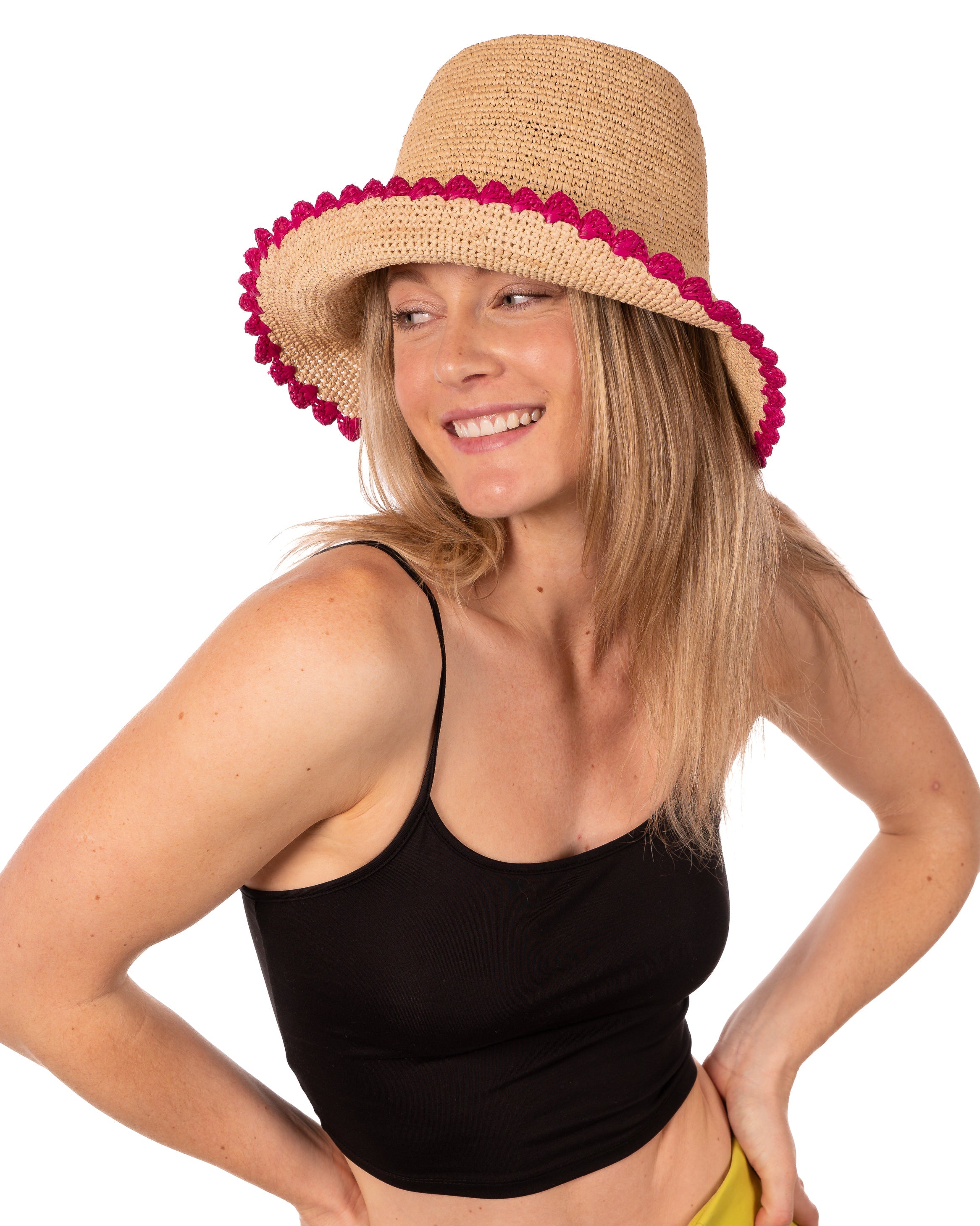 Model wearing Kate Natural with Fuchsia Crochet Bucket Straw Hats with Colored Lace Weave Edge handmade woven raffia palm fiber in a solid hue of natural straw color in a subtle link texture with fuchsia hot/bright/barbie/pink lace weave floral edge trim around the outer brim two tone multicolor uv protection hat - Shebobo