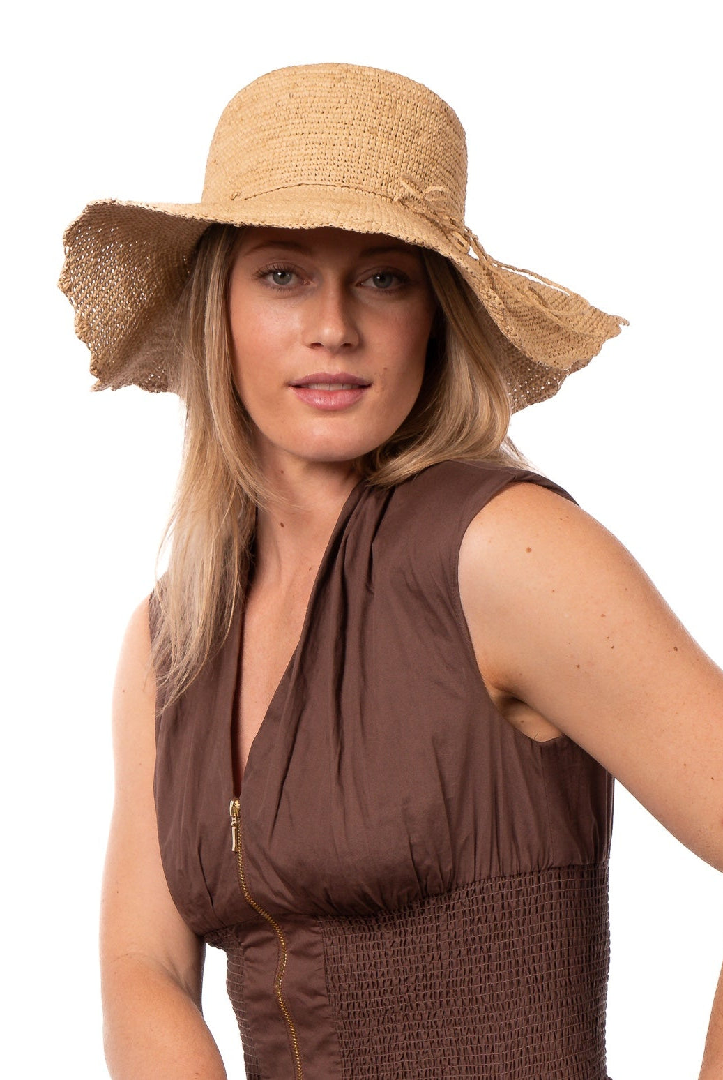 Model wearing 4" Brim Genevieve Natural Crochet Straw Sun Hat with Lace Weave Edge handmade raffia palm fiber crochet solid hue natural straw color rounded crown with detailed lace weave edge and matching adjustable hat band - Shebobo