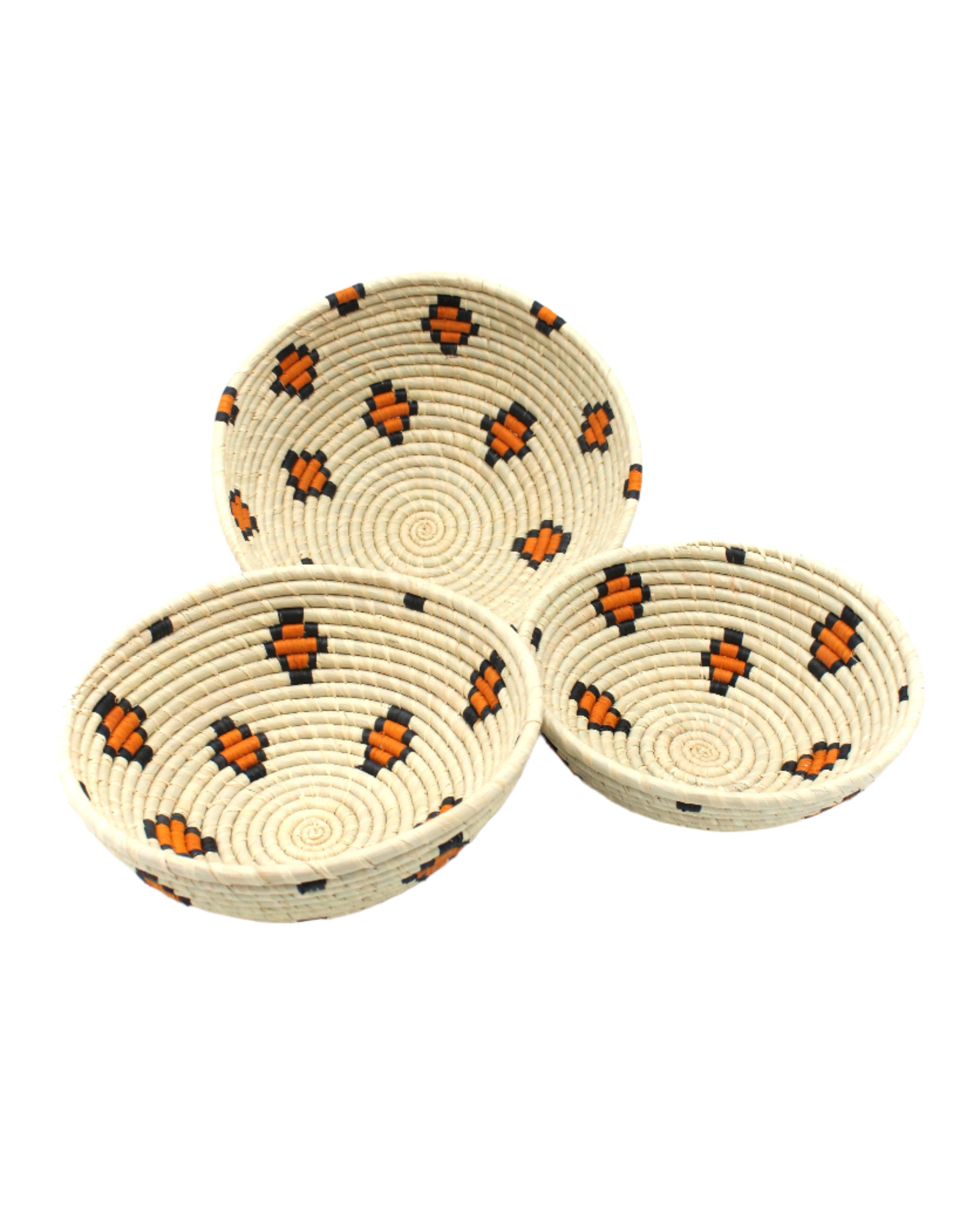 Amara Raffia Straw Decor Display Basket Bowls: Set of 3 handmade woven natural raffia palm fiber in a crochet loop technique concentric coiled circular pattern with natural straw color centered in the bottom with diamond pattern of saffron yellow/orange edged in black around the sides of the bowl with natural straw color base set of small, medium, and large straw display bowls - Shebobo