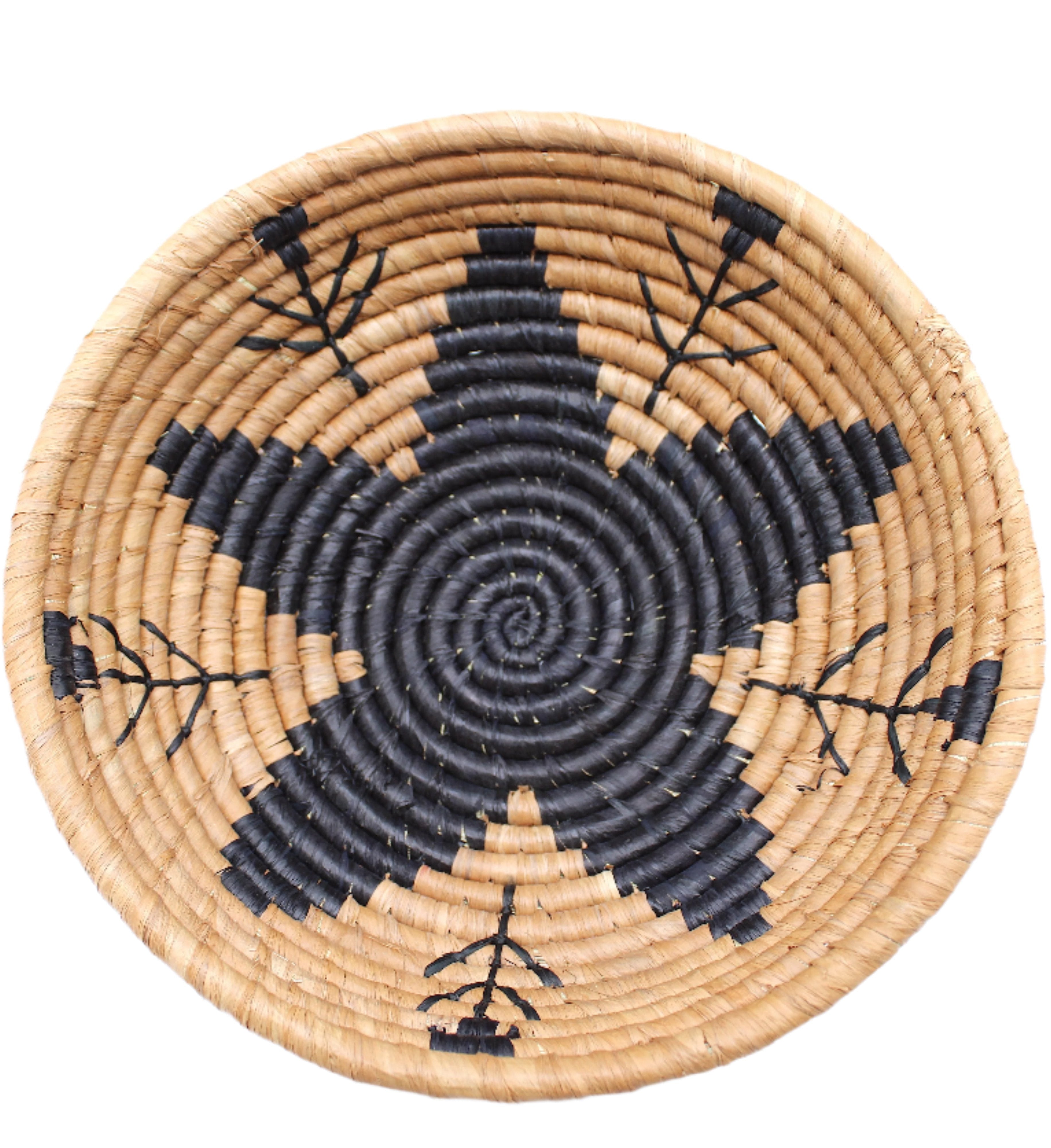 Detail view Amara Raffia Straw Decor Display Basket Bowls: Set of 3 handmade woven natural raffia palm fiber in a crochet loop technique concentric coiled circular pattern with centered black star or flower in the bottom of the bowl that goes up the cinnamon/tobacco/brown sides with matching black flower/arrow pattern on sides set of small, medium, and large straw display bowls - Shebobo