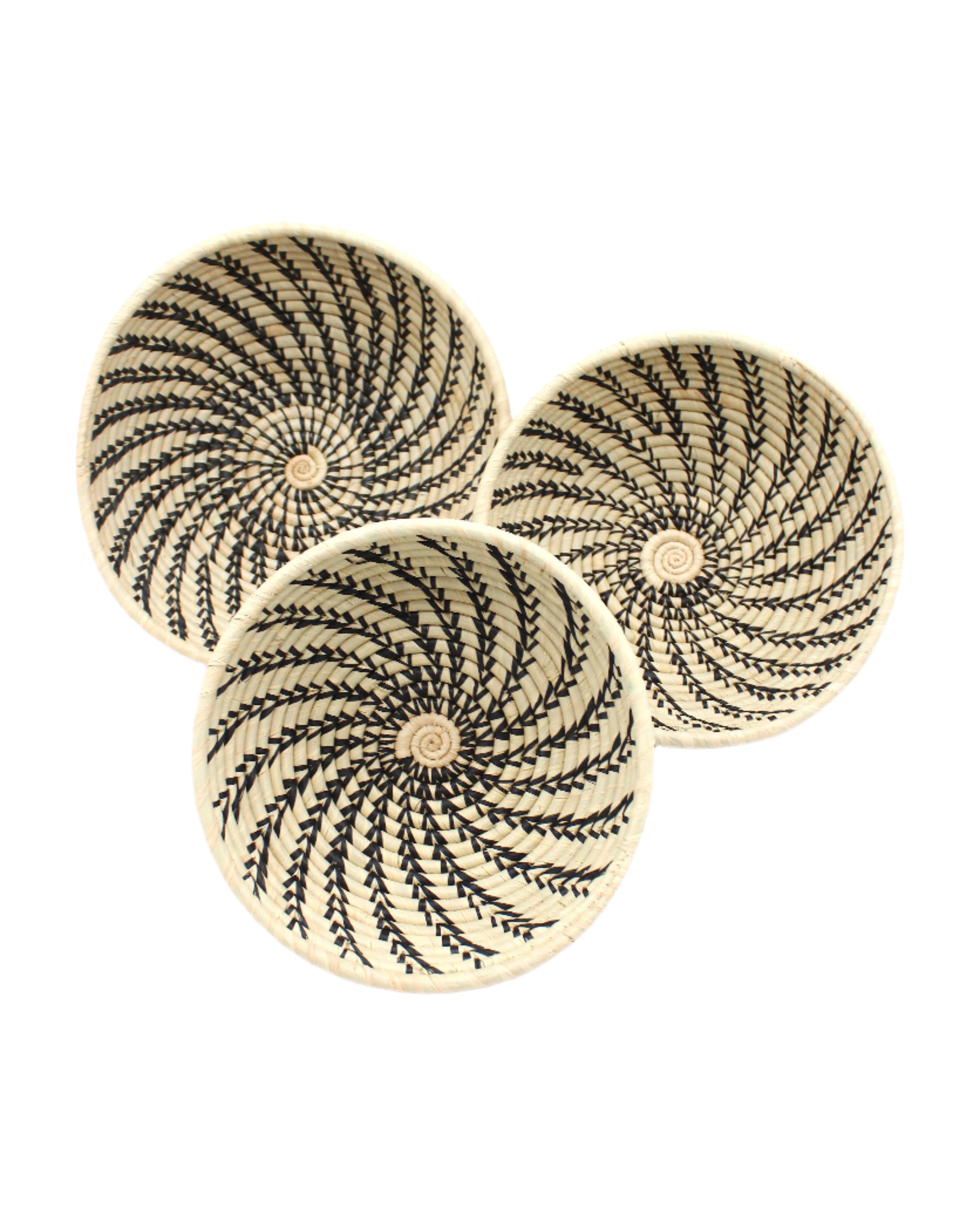 Amara Raffia Straw Decor Display Basket Bowls: Set of 3 handmade woven natural raffia palm fiber in a crochet loop technique concentric coiled circular pattern with natural straw color centered in the bottom and that go up the sides of the bowls with contrasting black swirl stitch pattern and matching natural rim/edge set of small, medium, and large straw display bowls - Shebobo