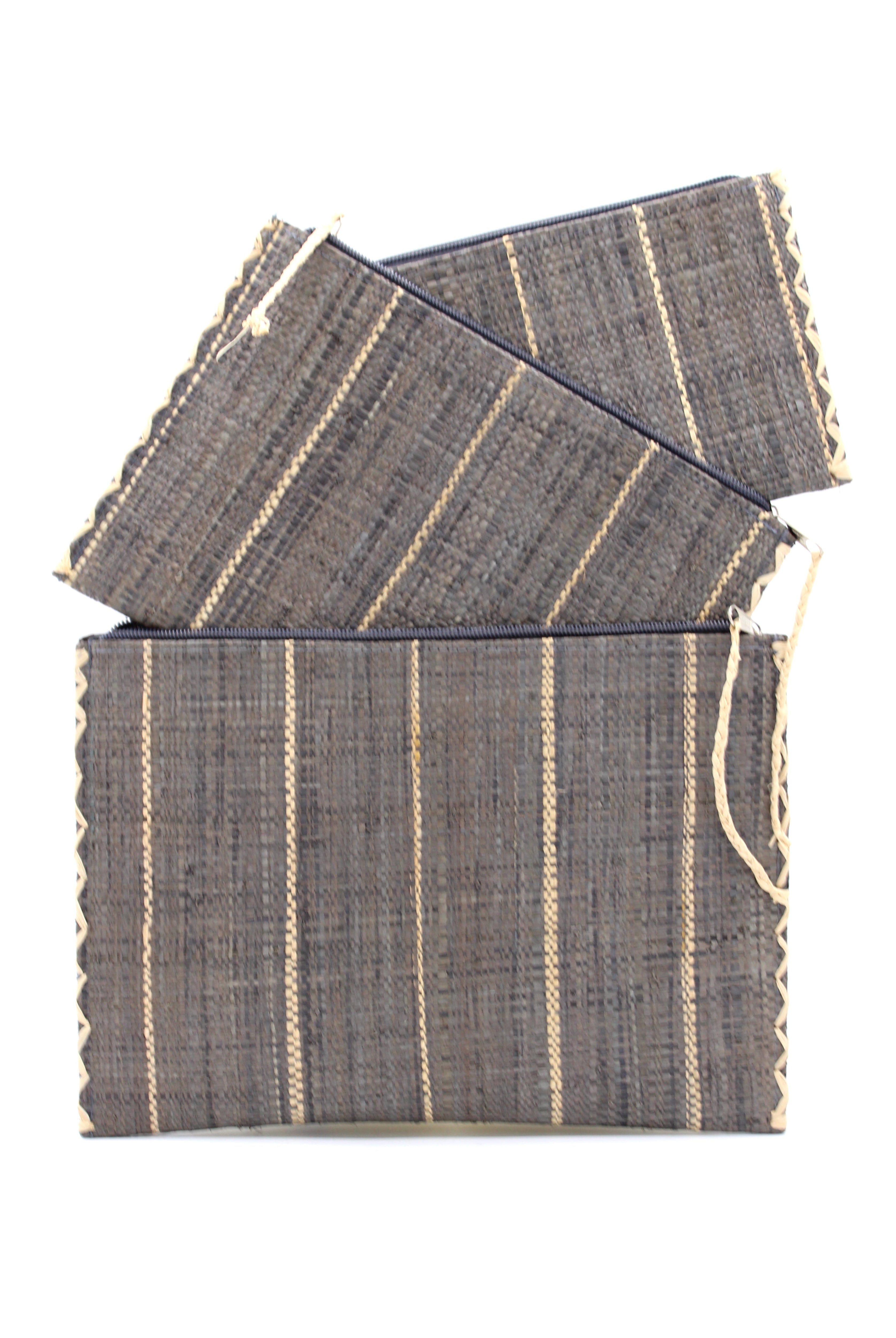Amelia Set of 3 Grey Nesting Zippered Straw Clutches Pinstripe Pattern handmade loomed raffia in wide vertical bands of grey with narrow bands of natural straw color with matching zipper and braided zipper pull with cross stitch edging in three sizes of small, medium, and large - Shebobo