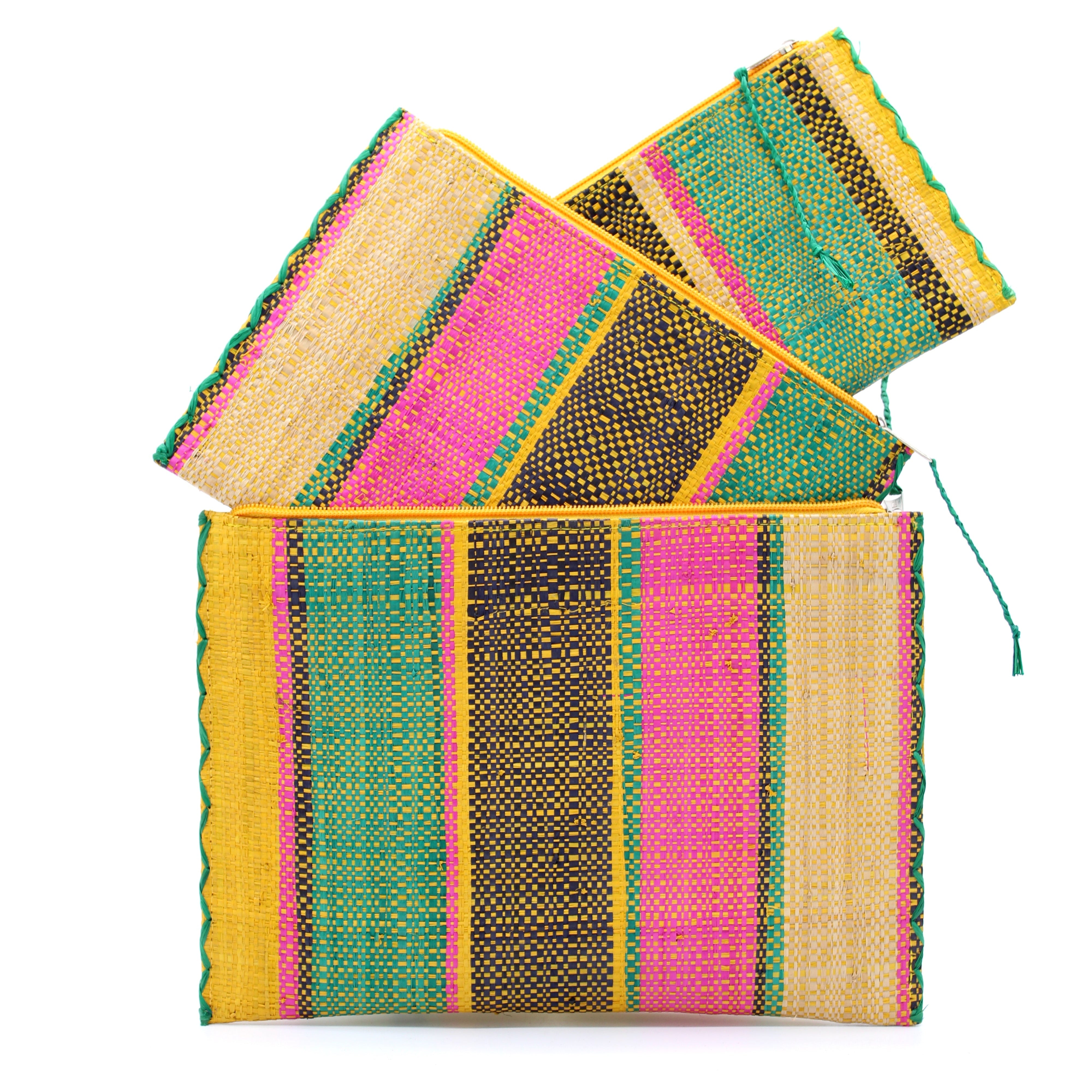 Amelia Set of 3 Nesting Zippered Straw Clutches Carmalita Multicolor Stripe Pattern handmade loomed raffia in multiple widths of vertical stripes in turquoise, black, fuchsia, and saffron with matching zipper and braided zipper pull with cross stitch edging in three sizes of small, medium, and large - Shebobo