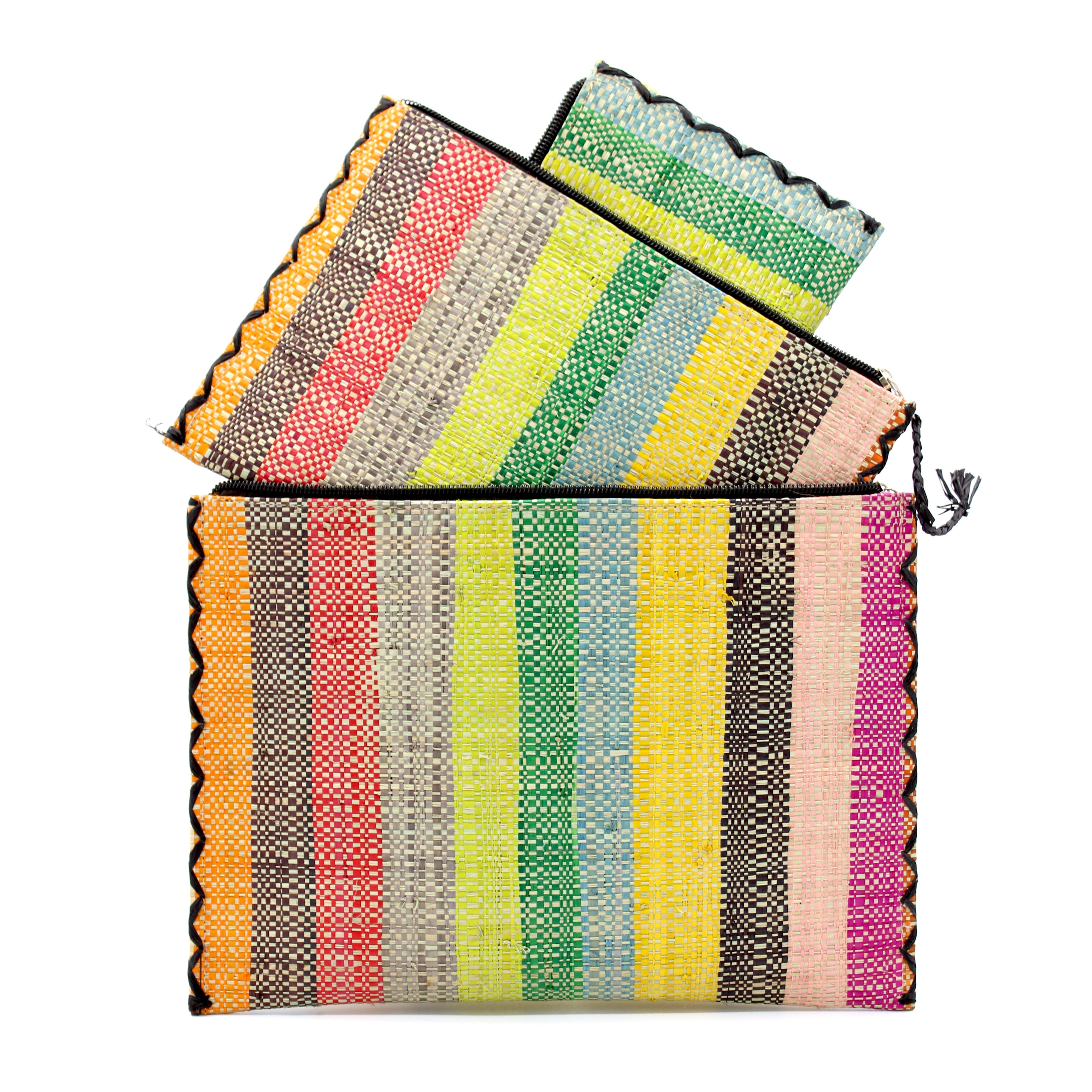 Amelia Set of 3 Nesting Zippered Straw Clutches Lollipop Multicolor Stripe Pattern handmade loomed raffia in multiple widths of vertical stripes in natural, orange, green, saffron, light blue, red, fuchsia, pink, black, grey, etc. with matching black zipper and braided zipper pull with cross stitch edging in three sizes of small, medium, and large - Shebobo