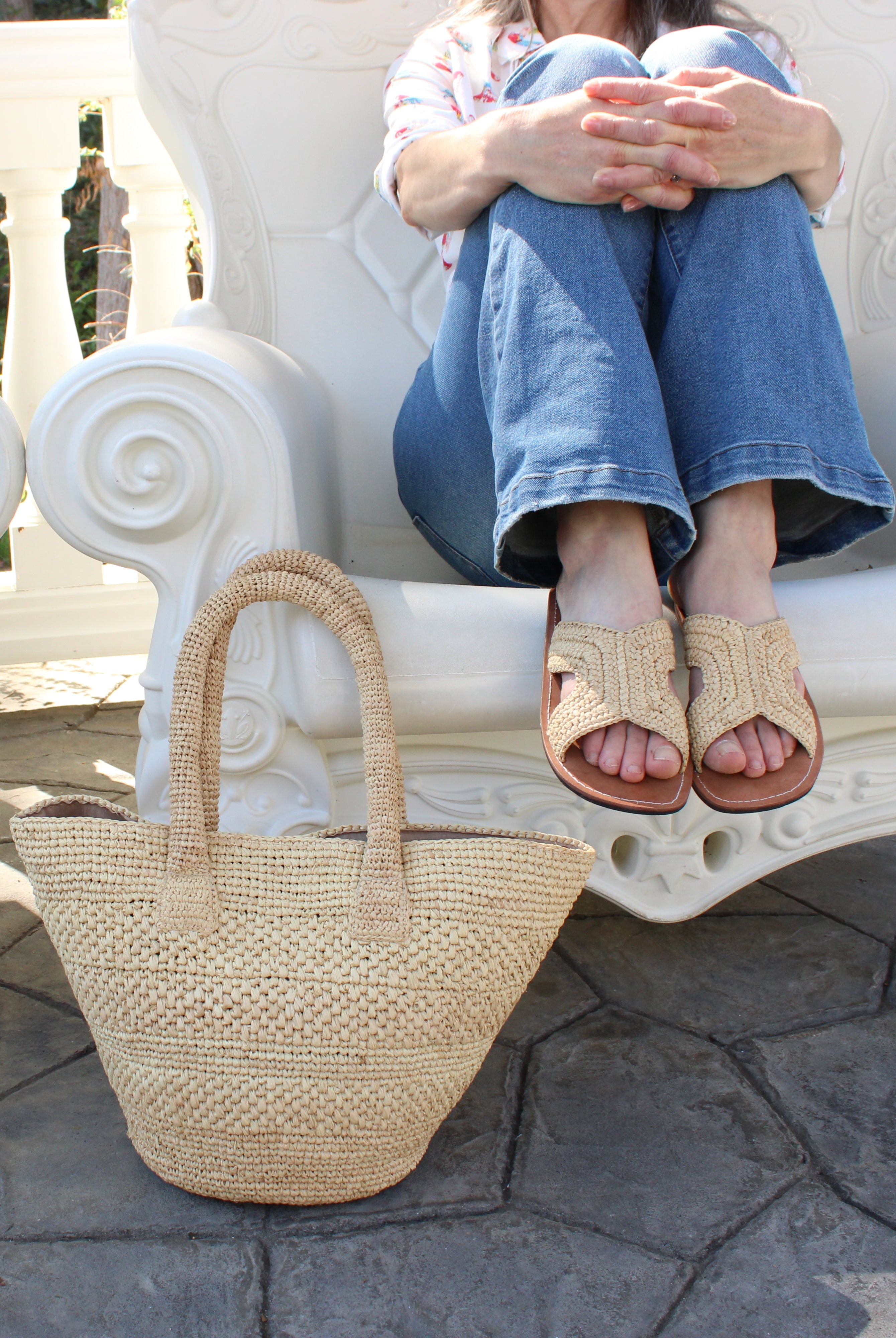 Model wearing Anakao Crochet Straw Basket Handbag handmade natural raffia palm fiber in a solid hue of natural straw color crochet into a multi width horizontal stripe pattern of varying link textures beach bag shoulder bag purse - Shebobo (with Lizzie Crochet Straw & Leather Sandal Shoes)