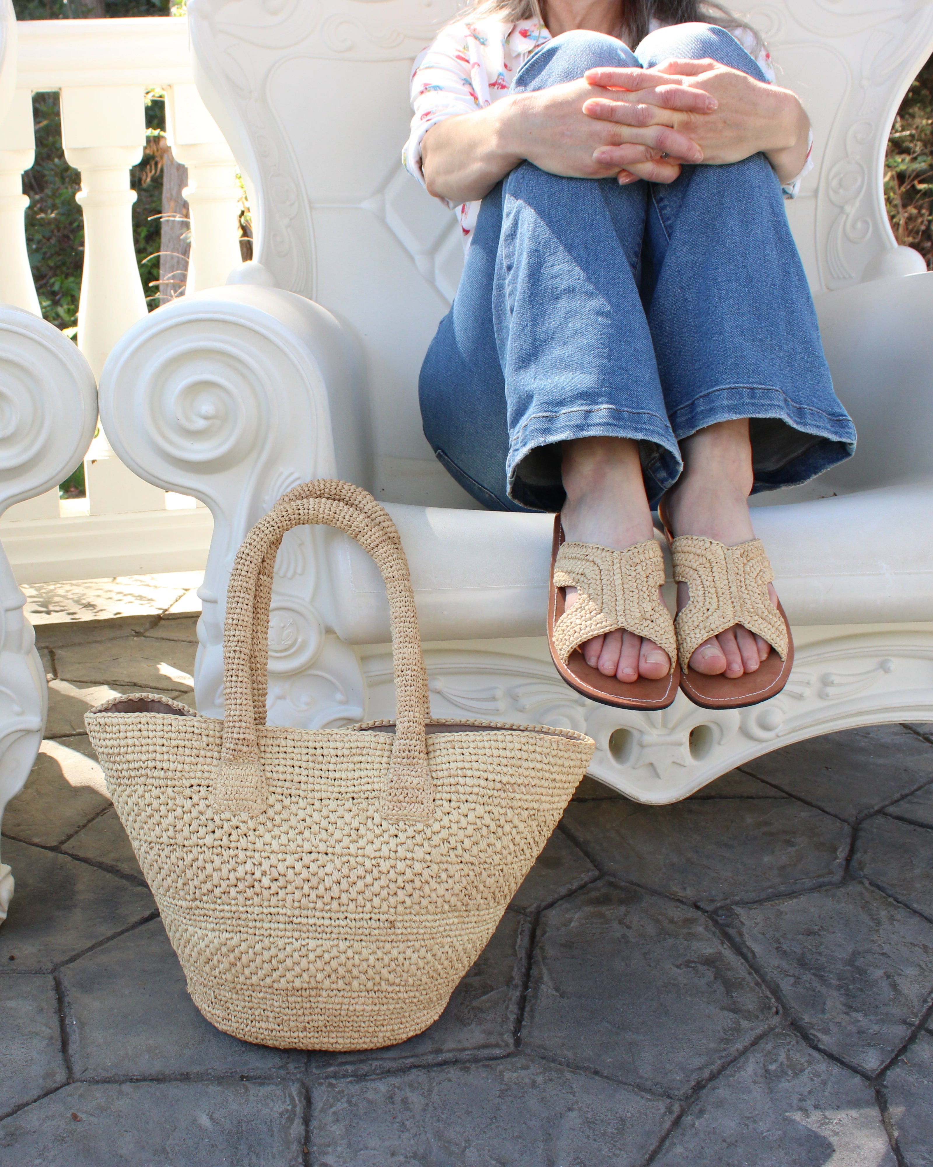 Model wearing Anakao Crochet Straw Basket Handbag handmade natural raffia palm fiber in a solid hue of natural straw color crochet into a multi width horizontal stripe pattern of varying link textures beach bag shoulder bag purse - Shebobo (with Lizzie Crochet Straw & Leather Sandal Shoes)
