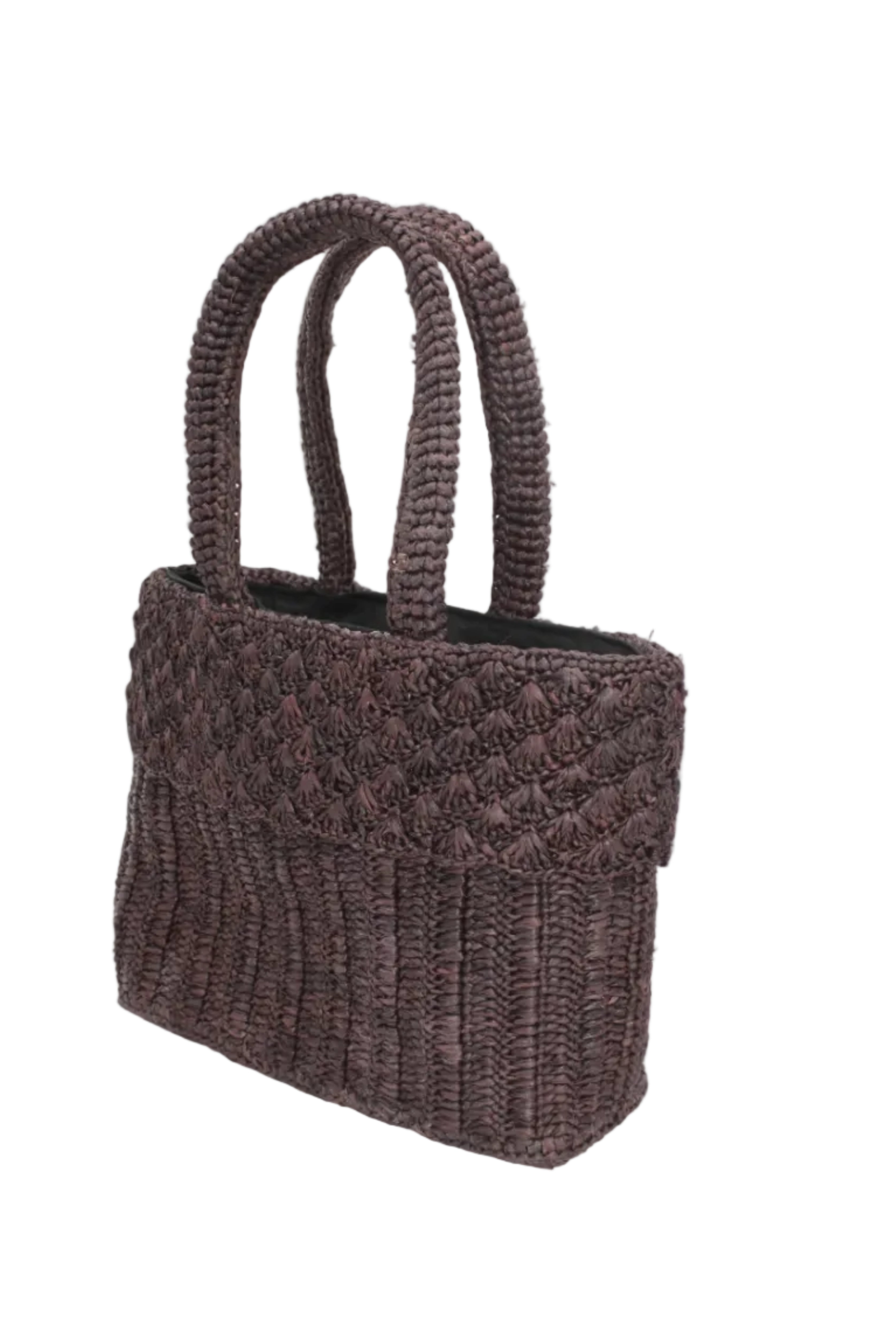 Side view Anna Petal Pattern Crochet Straw Basket Handbag handmade natural raffia palm fiber in a solid hue of Espresso chocolate/dark/brown crochet in multiple textures resulting in a subtle pattern of vertical linked bands on the bottom 2/3 of the bag, and a floral petal or shell pattern on the upper third with rolled panel of links making up the handles Beach Bag Purse - Shebobo