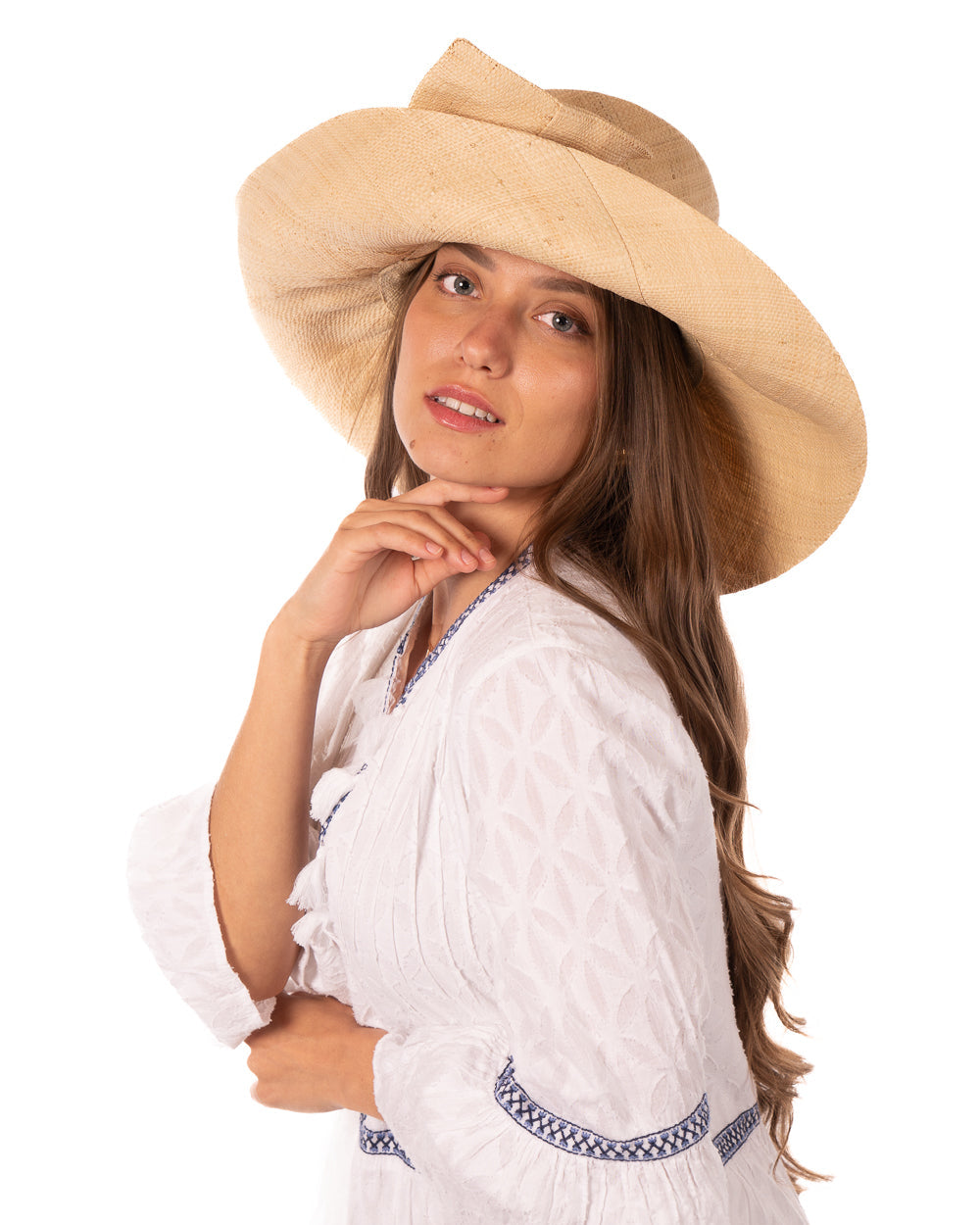 Model wearing Audrey 7" Wide Brim Solid Color Straw Sun Hats with Big Bow handmade loomed natural raffia straw fiber in a solid hue of natural straw color with matching oversized big bow embellishment hat band - Shebobo