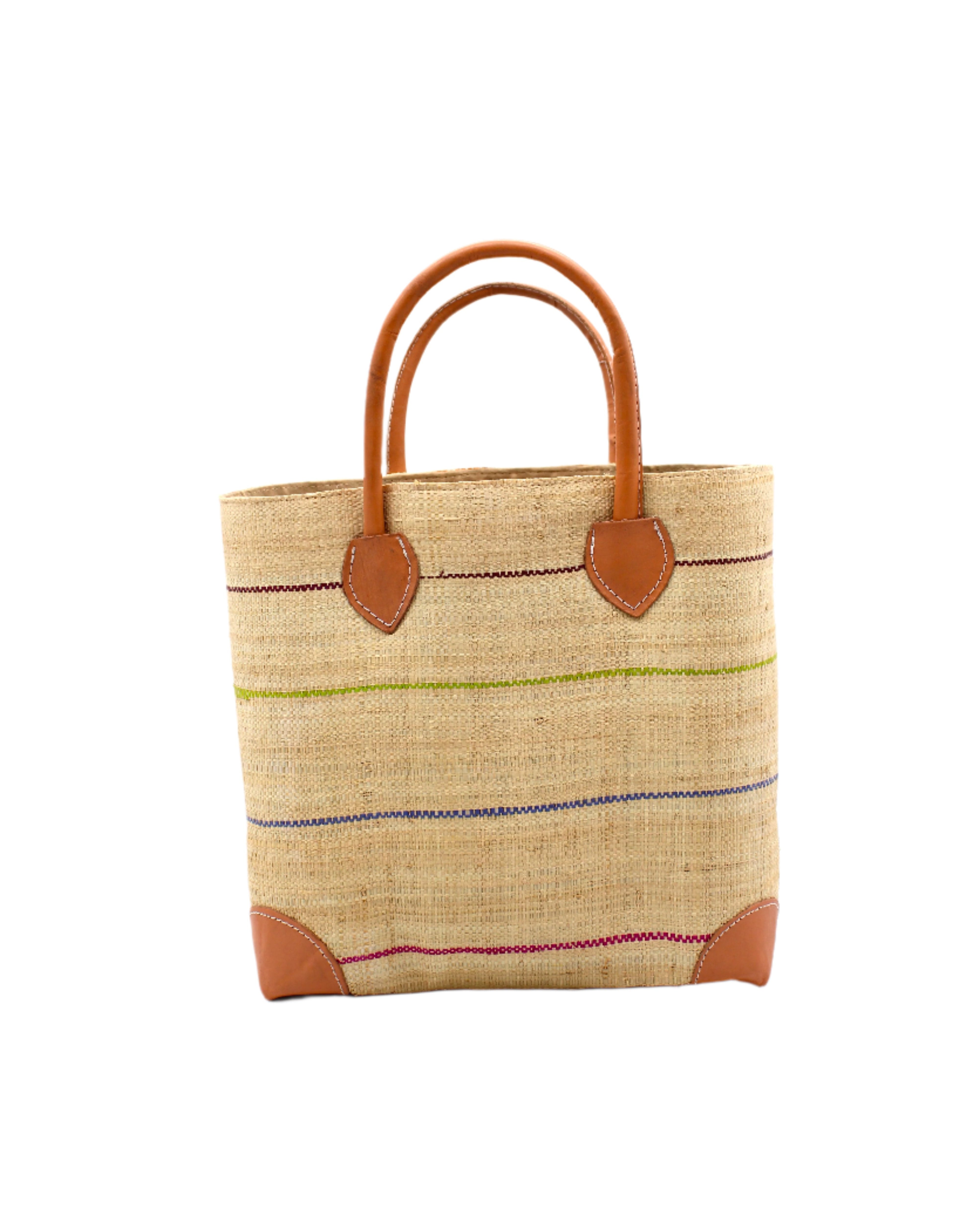 Augustine pinstripes straw basket bag handmade loomed raffia in natural wide horizontal bands with multicolor bright colors of coral red/orange, bordeaux dark red, lime, grey, and fuchsia pink small bands running through in a stripe pattern with leather accents and handles handbag purse - Shebobo