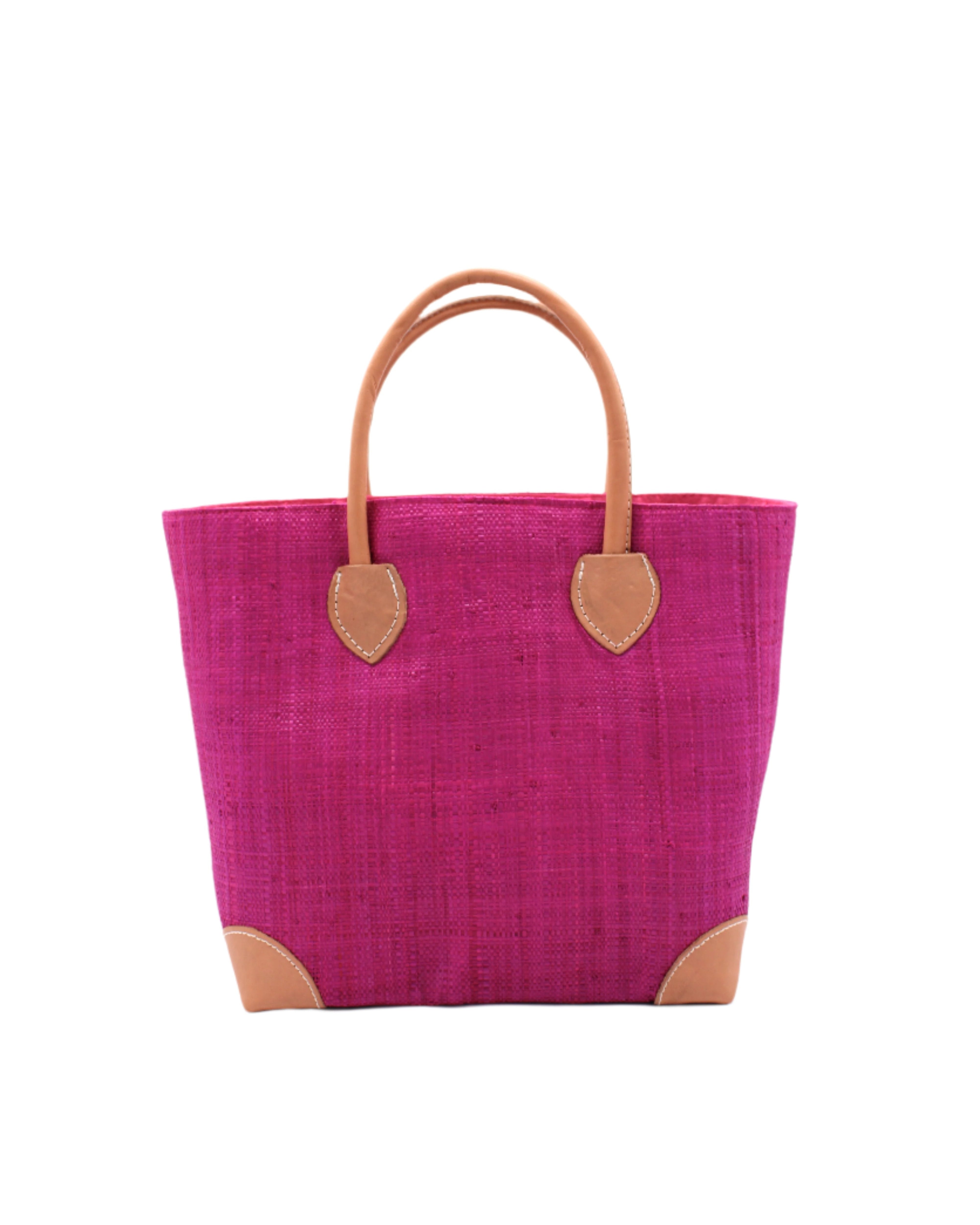 Augustine Straw Basket Bag Fuchsia handmade loomed raffia palm fiber in a solid hue of fuchsia/bright/barbie/hot pink handbag purse with leather accents and handles beach bag - Shebobo