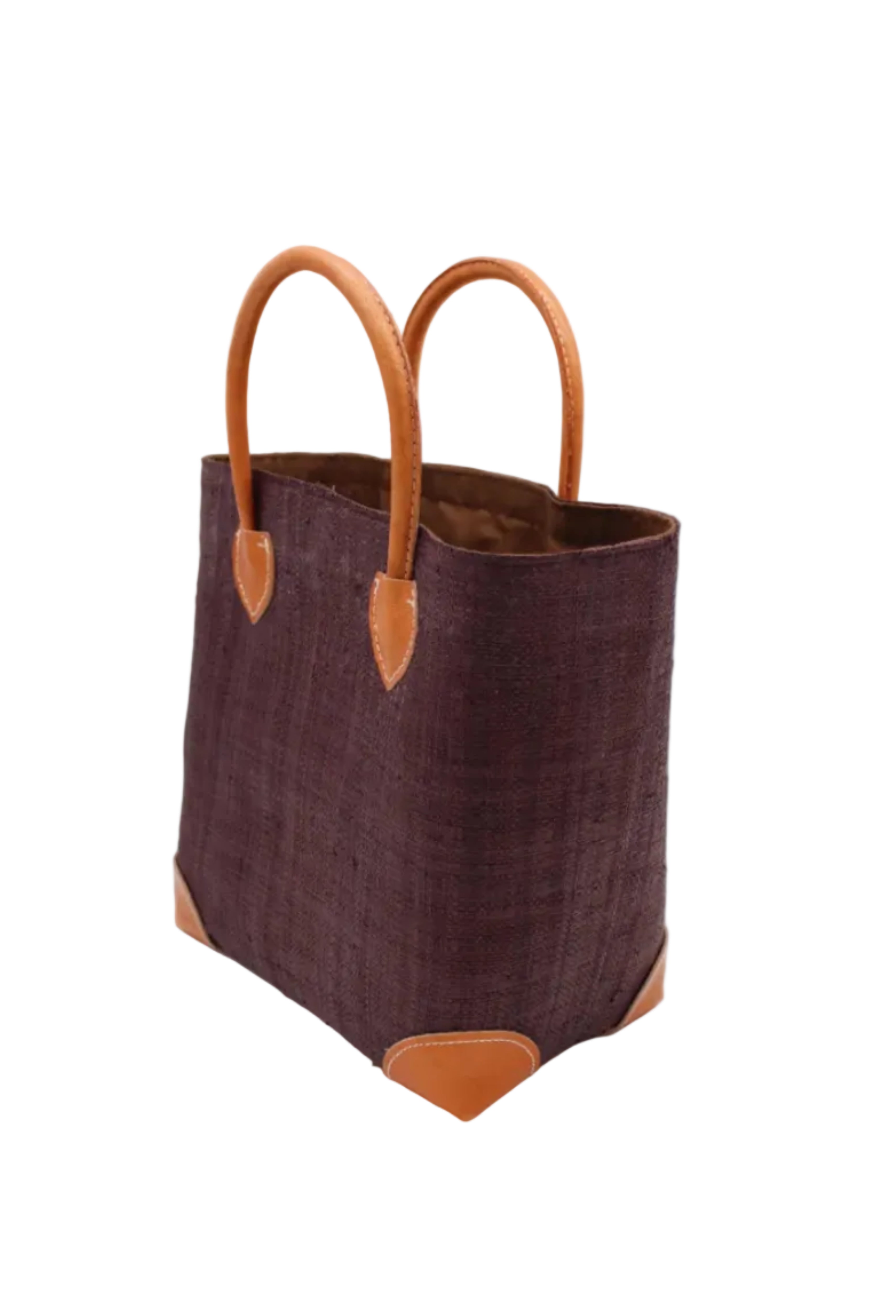 Side view Augustine Straw Basket Bag Mocha handmade loomed raffia palm fiber in a solid hue of mocha chocolate/dark/brown handbag purse with leather accents and handles beach bag - Shebobo