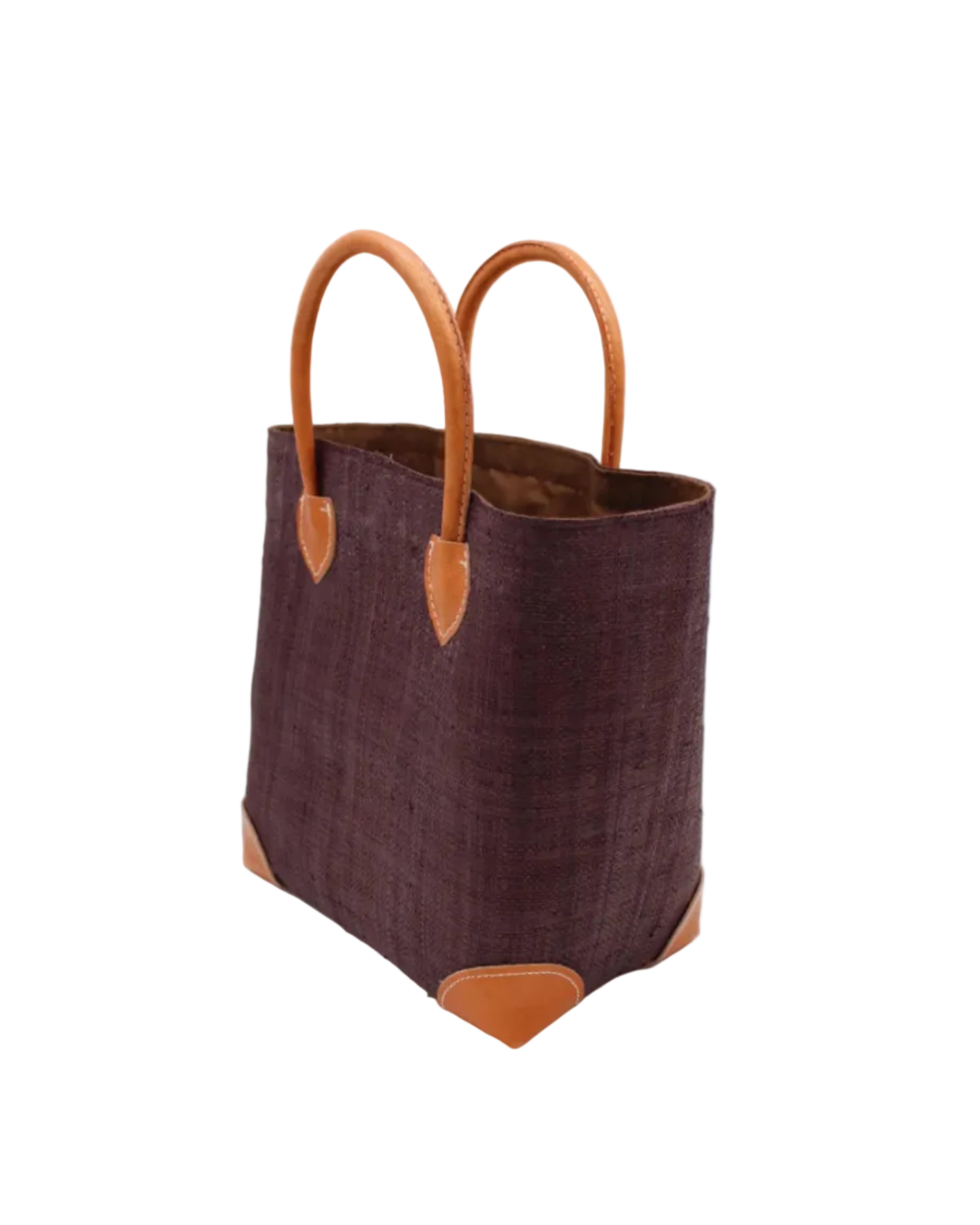 Side view Augustine Straw Basket Bag Mocha handmade loomed raffia palm fiber in a solid hue of mocha chocolate/dark/brown handbag purse with leather accents and handles beach bag - Shebobo
