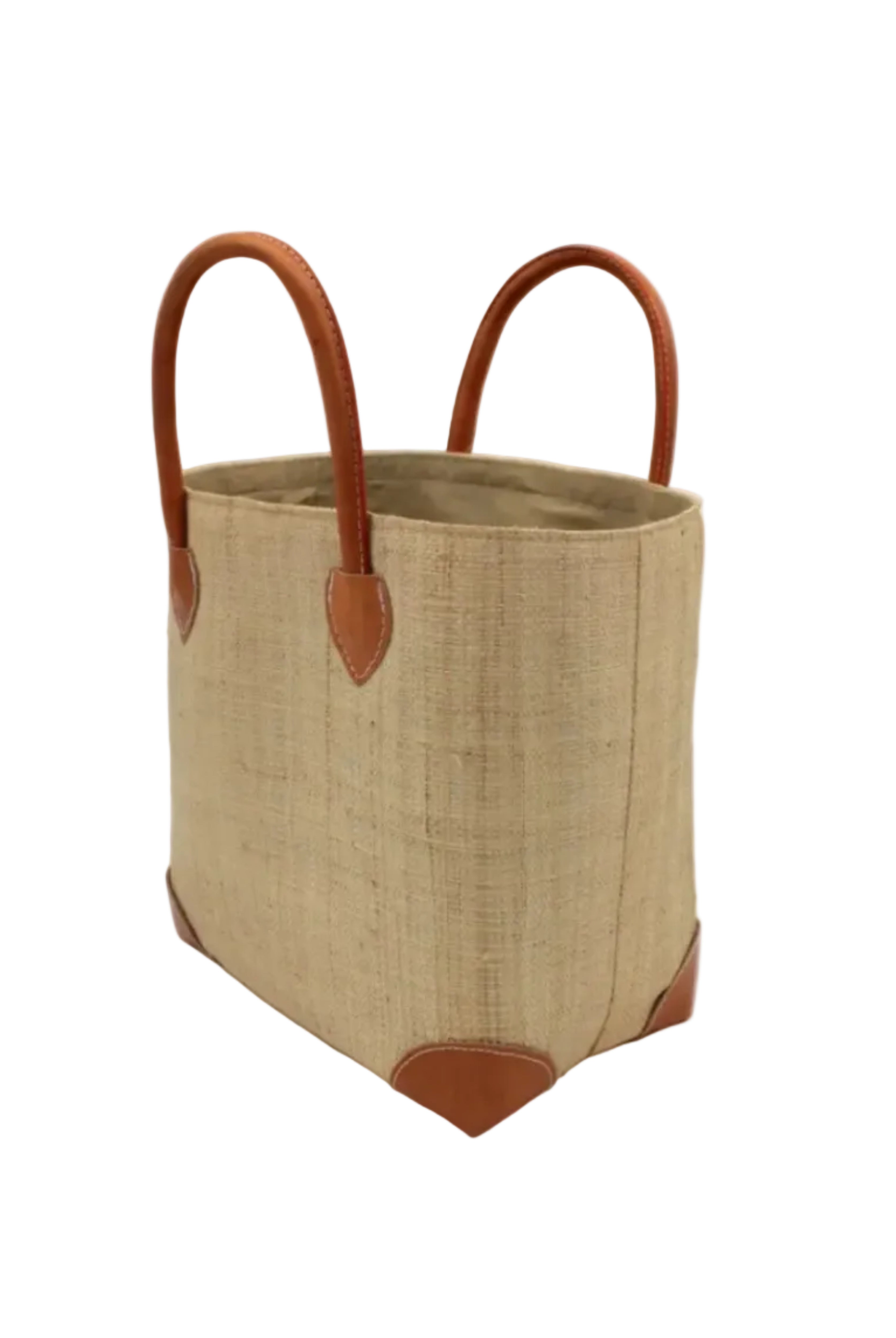Side view Augustine Straw Basket Bag Natural handmade loomed raffia palm fiber in a solid hue of natural straw color handbag purse with leather accents and handles beach bag - Shebobo