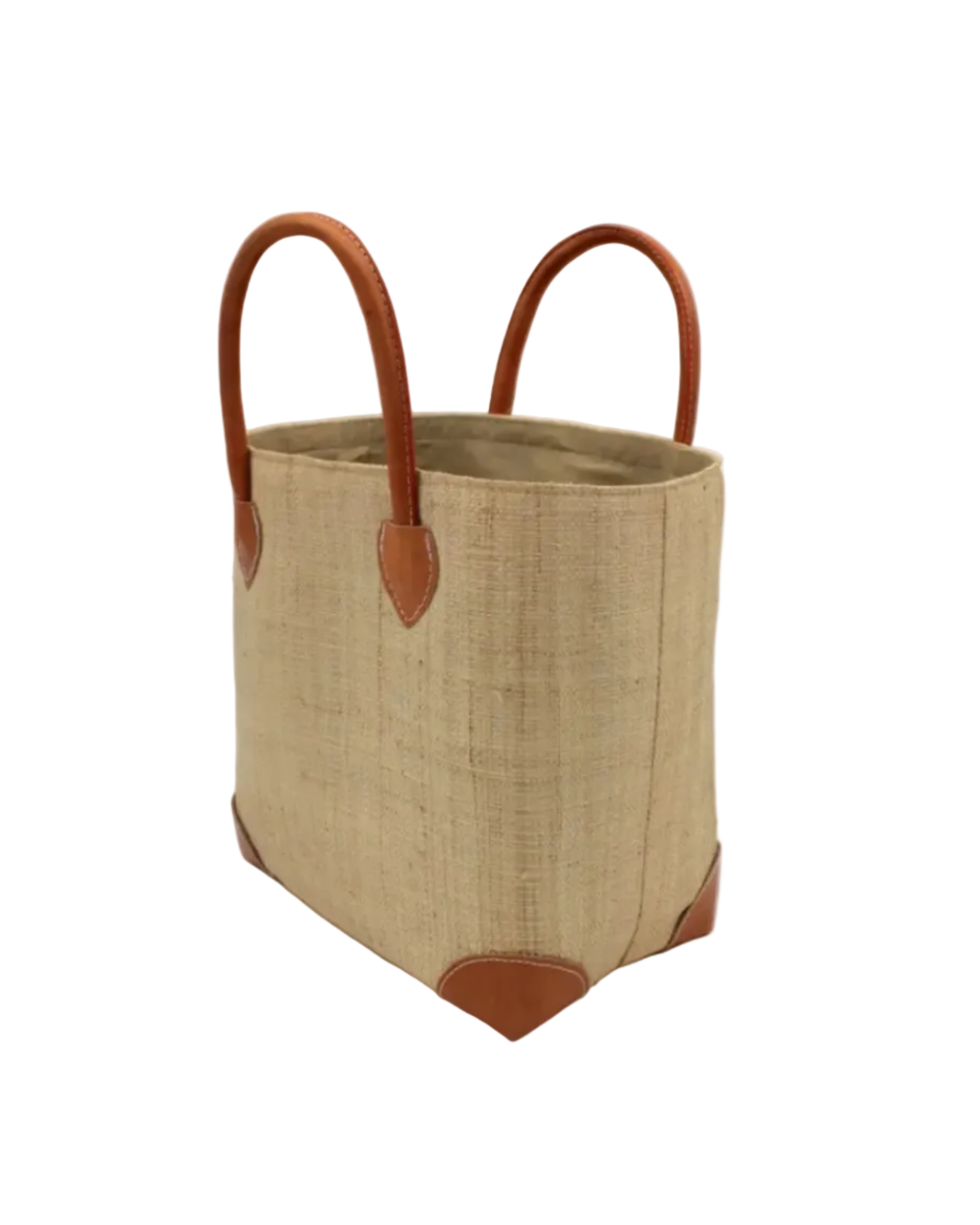 Side view Augustine Straw Basket Bag Natural handmade loomed raffia palm fiber in a solid hue of natural straw color handbag purse with leather accents and handles beach bag - Shebobo