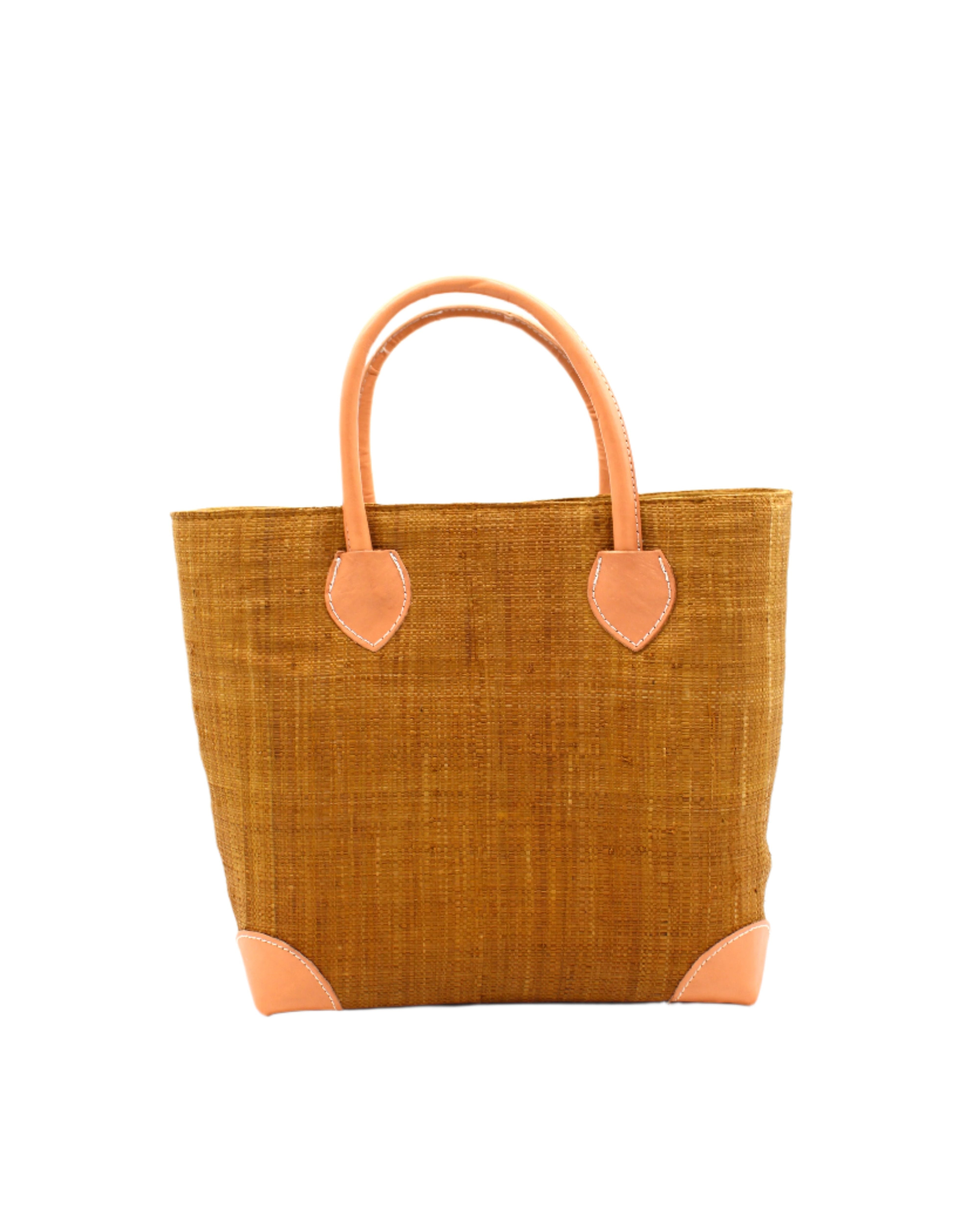 Augustine Straw Basket Bag Cinnamon handmade loomed raffia palm fiber in a solid hue of cinnamon/tobacco/brown handbag purse with leather accents and handles beach bag - Shebobo
