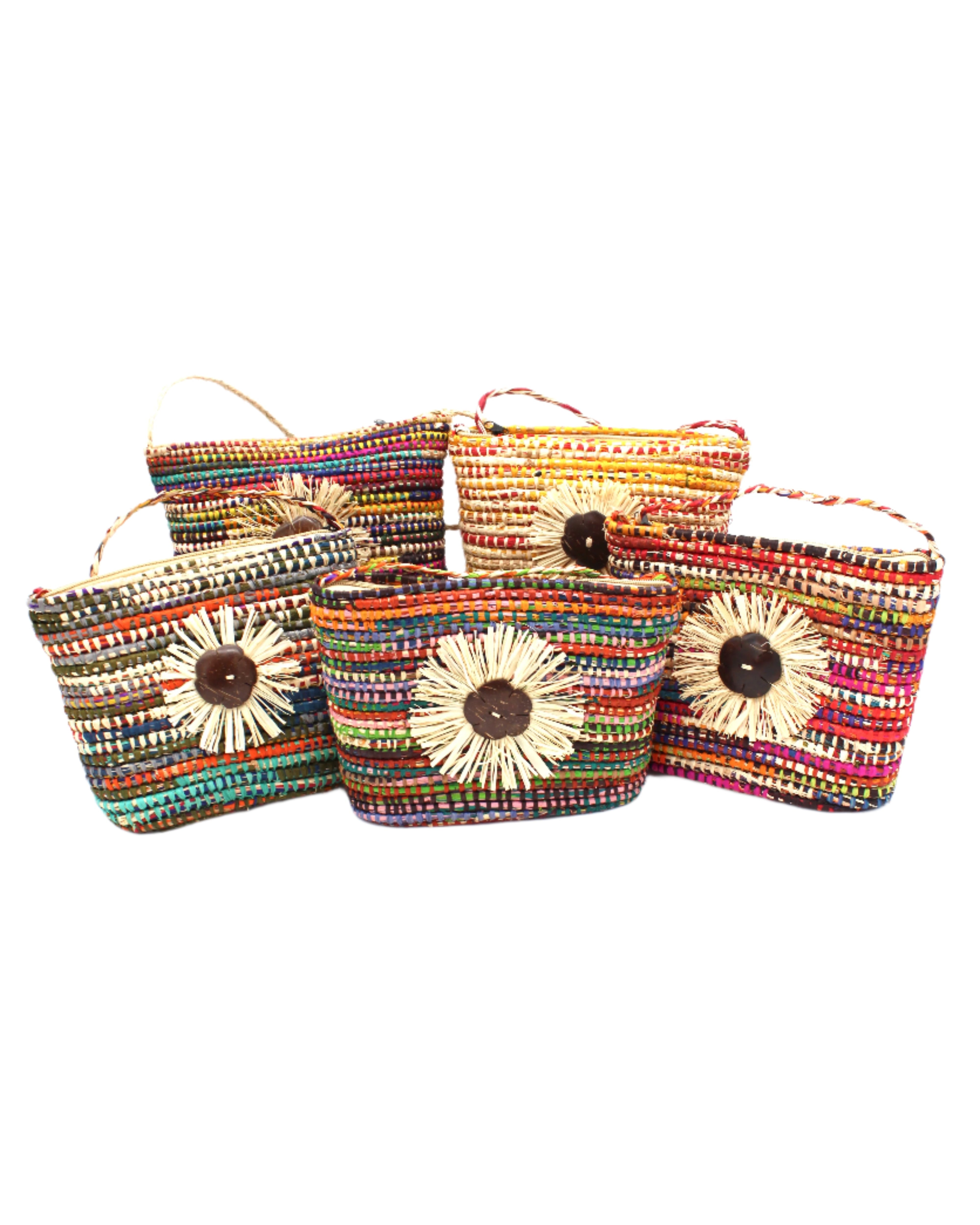 Barbados Crochet Straw Crossbody Bag with Flower Detail handmade crochet raffia palm fiber in a loop technique creating horizontal concentric multicolor wrapped bands with assorted combined colors and carved coconut button flower with natural straw color brushed raw fringe edge flower detail embellishment centered on the bag purse - Shebobo