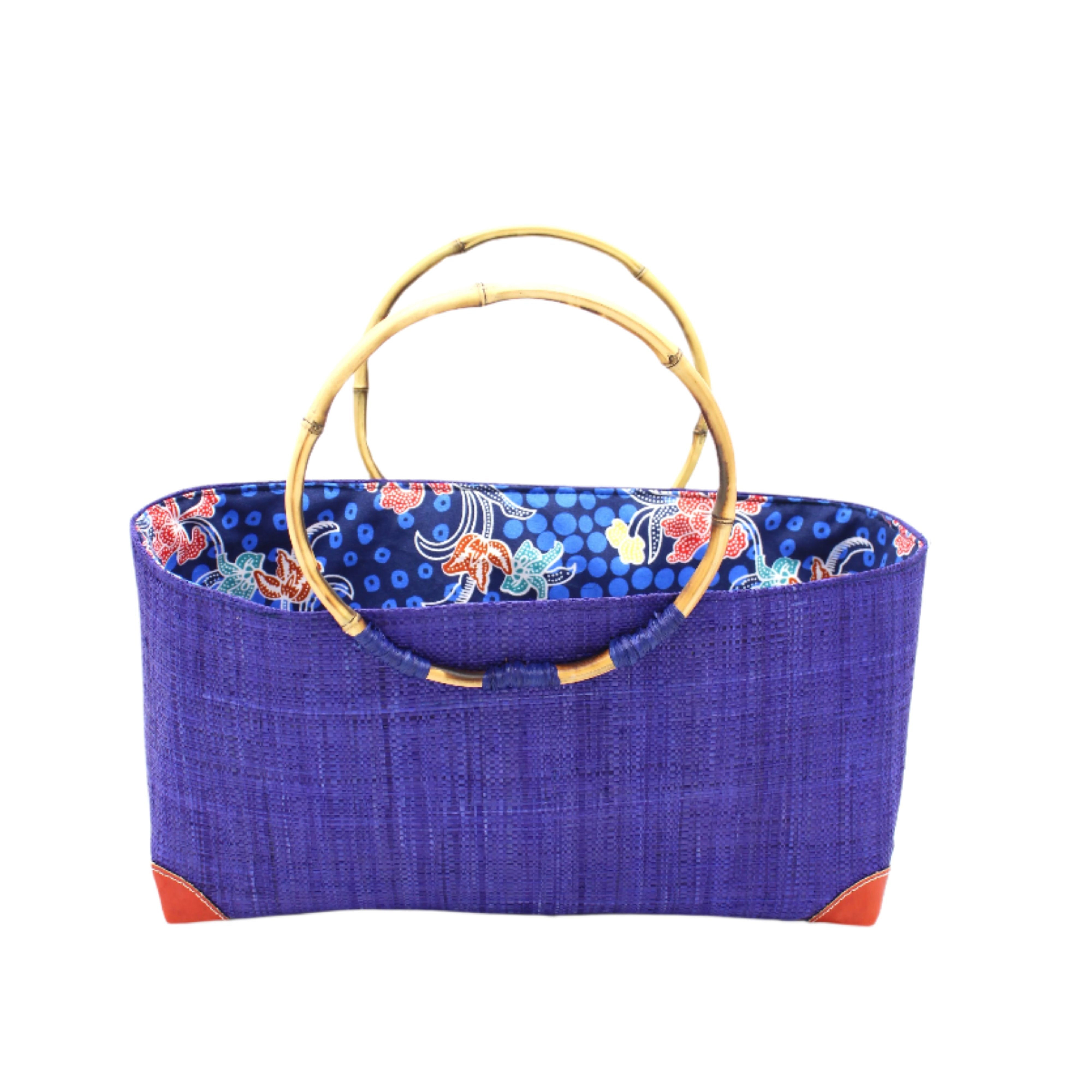Bebe Straw Handbag with Bamboo Handle handmade loomed natural raffia palm fiber in a solid hue of Dusk dark/navy/blue with molded circular bamboo handles, leather feet, and assorted print African wax-cloth fabric liner - Shebobo