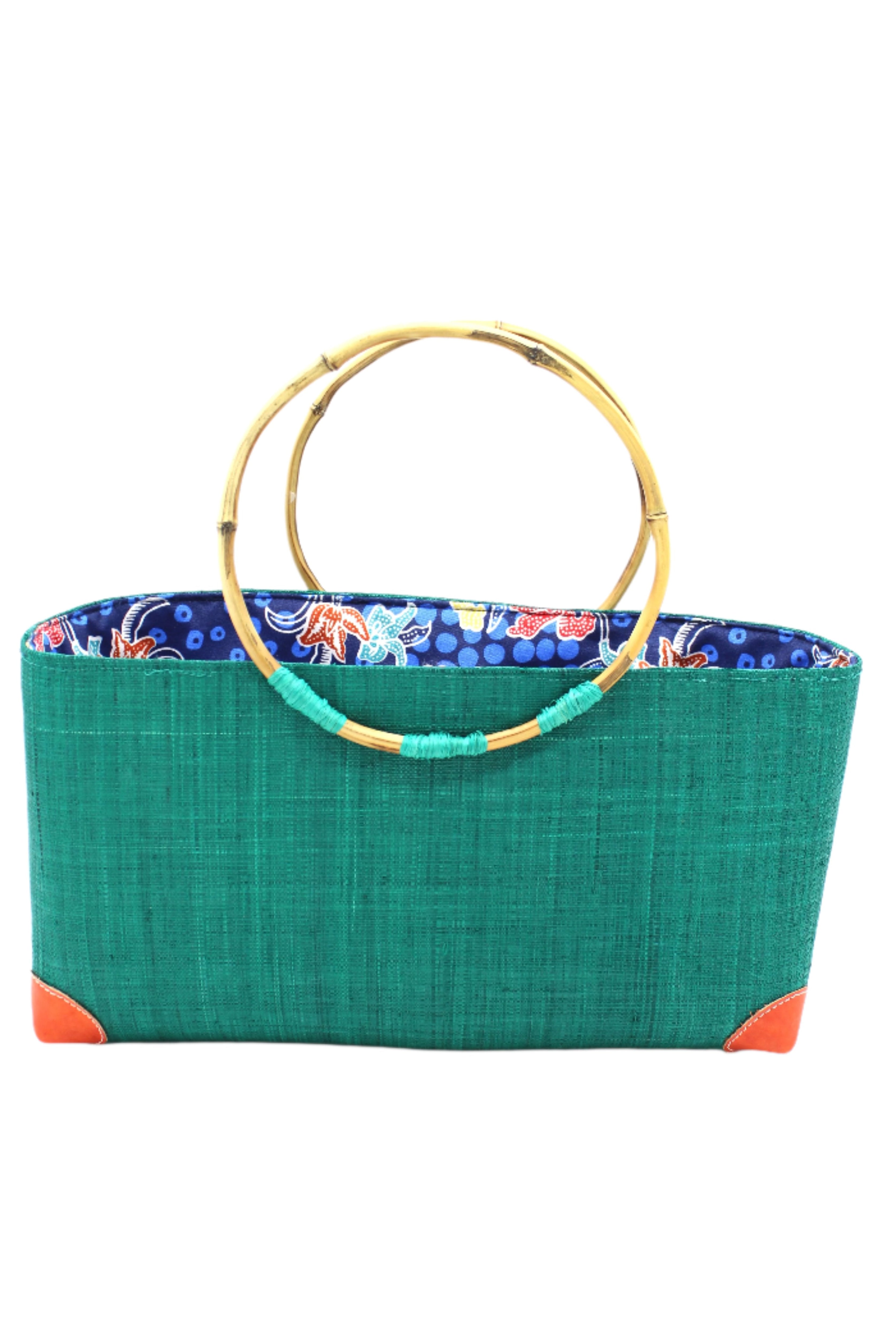 Bebe Straw Handbag with Bamboo Handle handmade loomed natural raffia palm fiber in a solid hue of teal dark/blue/green with molded circular bamboo handles, leather feet, and assorted print African wax-cloth fabric liner - Shebobo