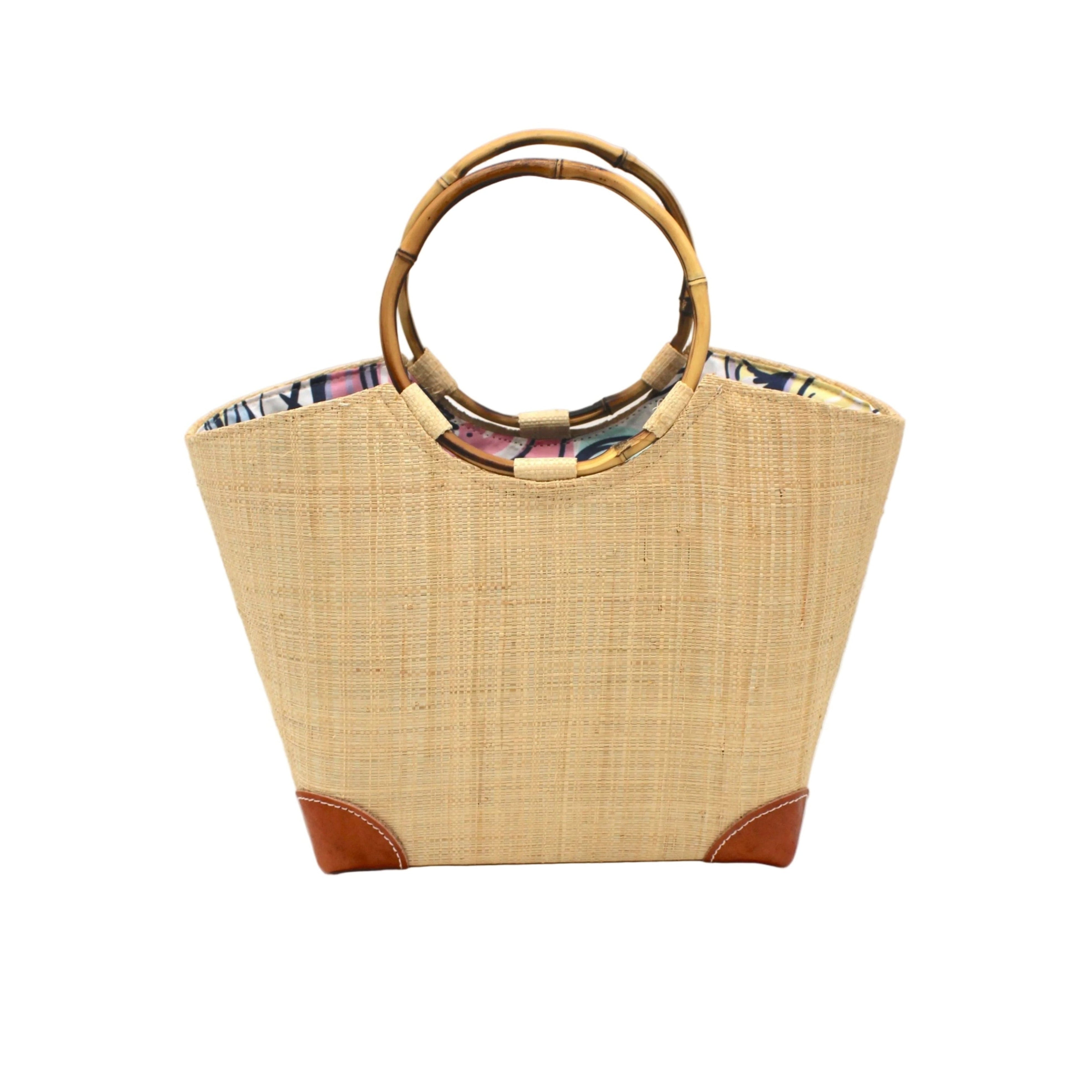 Betty Straw Bucket Bag with Bamboo Handles handmade loomed natural raffia palm fiber in a solid hue of natural straw color with circular bamboo handles, leather feet, and colorful African Print wax cloth liner handbag purse tote - Shebobo