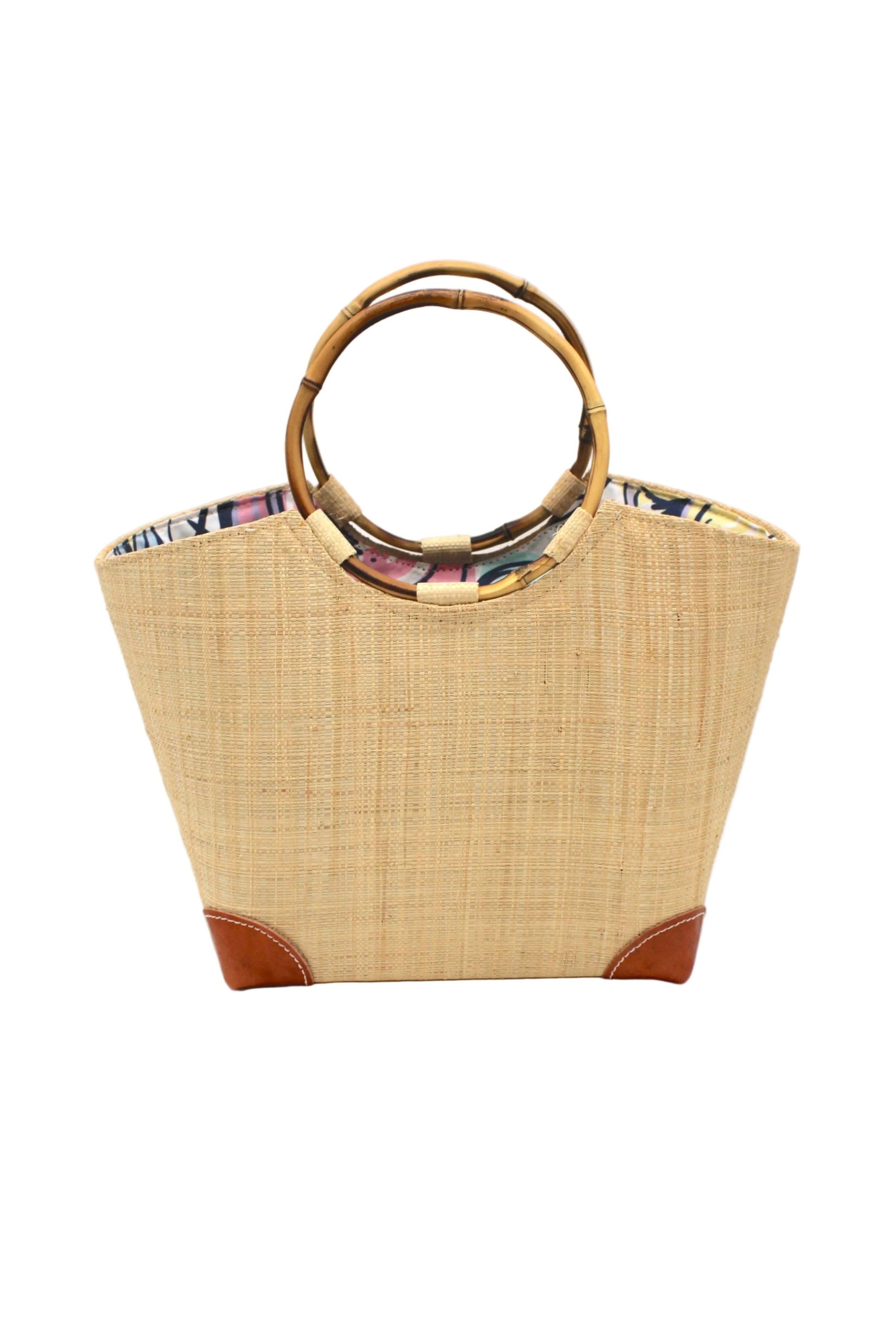 Betty Straw Bucket Bag with Bamboo Handles handmade loomed natural raffia palm fiber in a solid hue of natural straw color with circular bamboo handles, leather feet, and colorful African Print wax cloth liner handbag purse tote - Shebobo