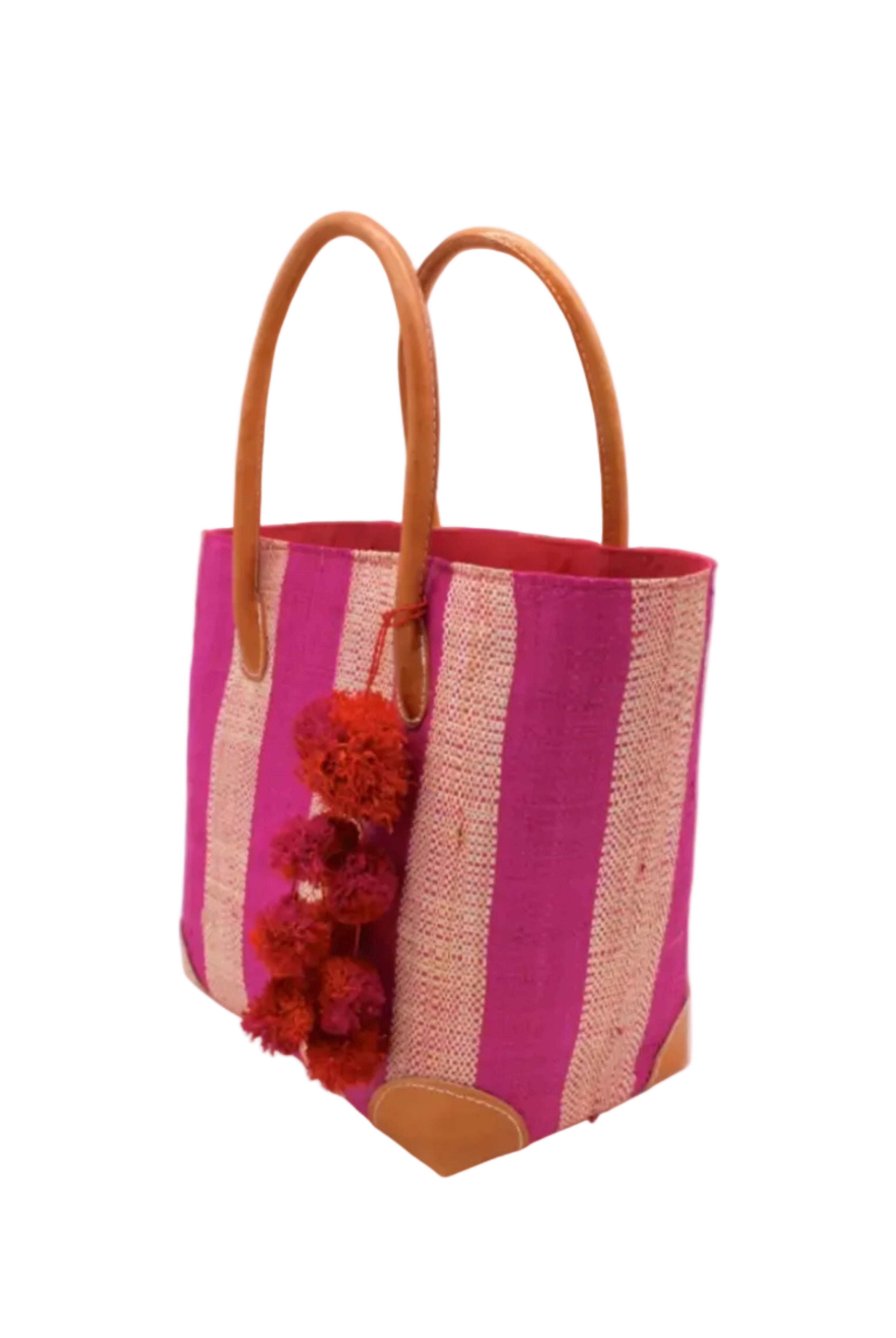 Side view Bora Bora Fuchsia Two Tone Stripes Straw Basket Bag with Waterfall Pompoms Charm Embellishment handmade loomed natural raffia palm fiber in a multicolor horizontal stripe pattern of even width wide bands of fuchsia hot/bright/barbie/pink and natural straw color with leather handles and feet plus matching waterfall pompom charm embellishment handbag beach bag - Shebobo