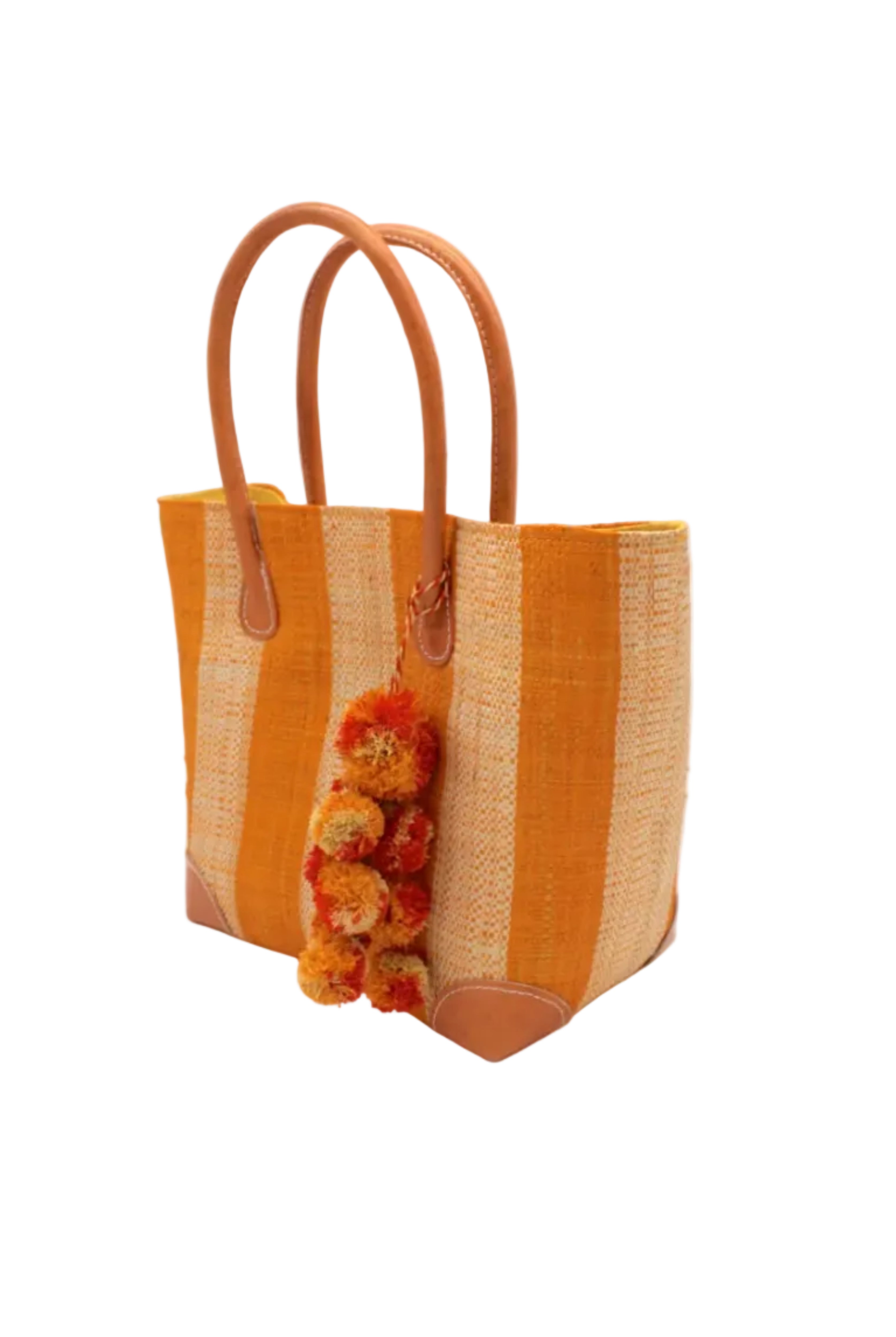 Side view Bora Bora Saffron Two Tone Stripes Straw Basket Bag with Waterfall Pompoms Charm Embellishment handmade loomed natural raffia palm fiber in a multicolor horizontal stripe pattern of even width wide bands of saffron orange/yellow and natural straw color with leather handles and feet plus matching waterfall pompom charm embellishment handbag beach bag - Shebobo