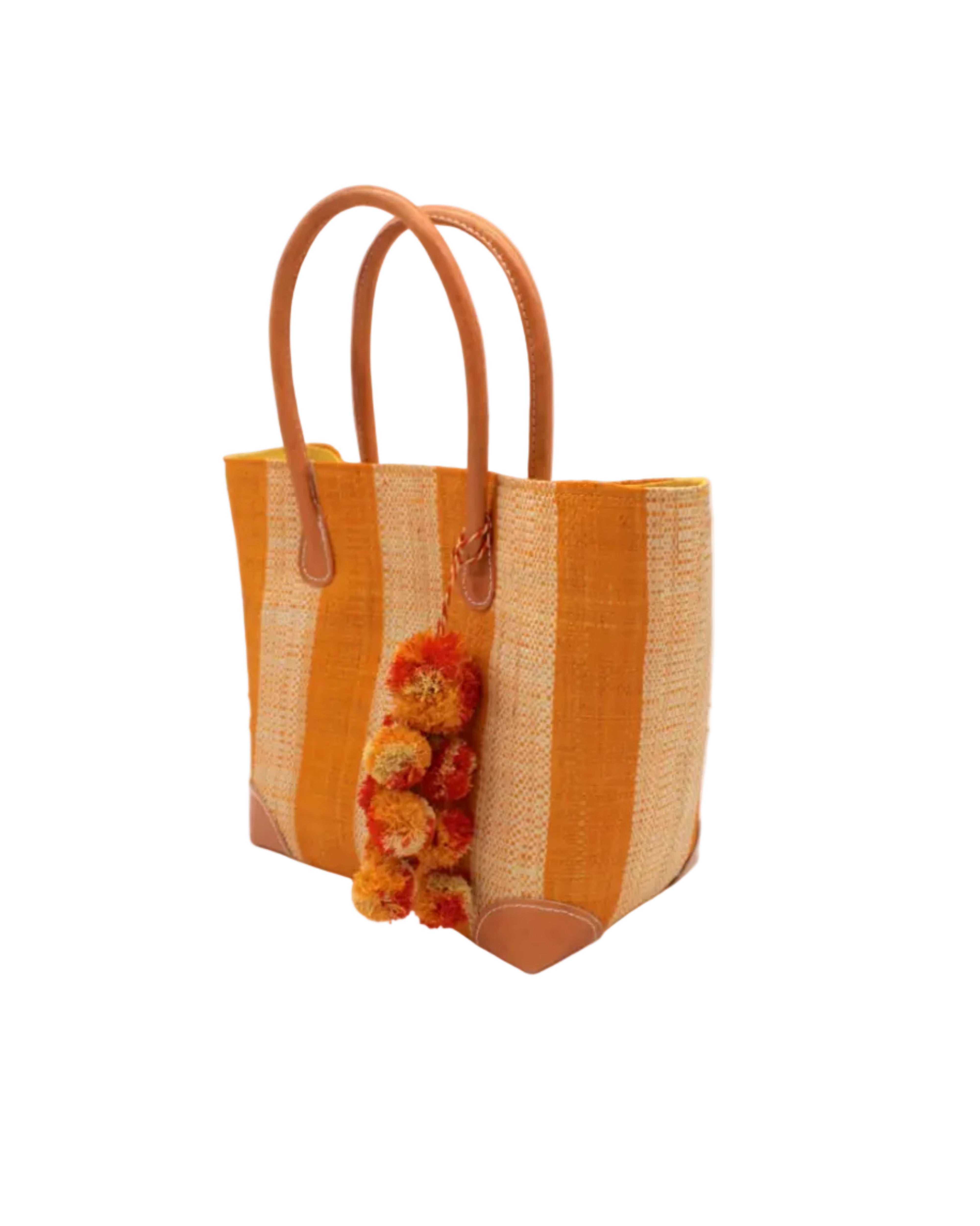 Side view Bora Bora Saffron Two Tone Stripes Straw Basket Bag with Waterfall Pompoms Charm Embellishment handmade loomed natural raffia palm fiber in a multicolor horizontal stripe pattern of even width wide bands of saffron orange/yellow and natural straw color with leather handles and feet plus matching waterfall pompom charm embellishment handbag beach bag - Shebobo