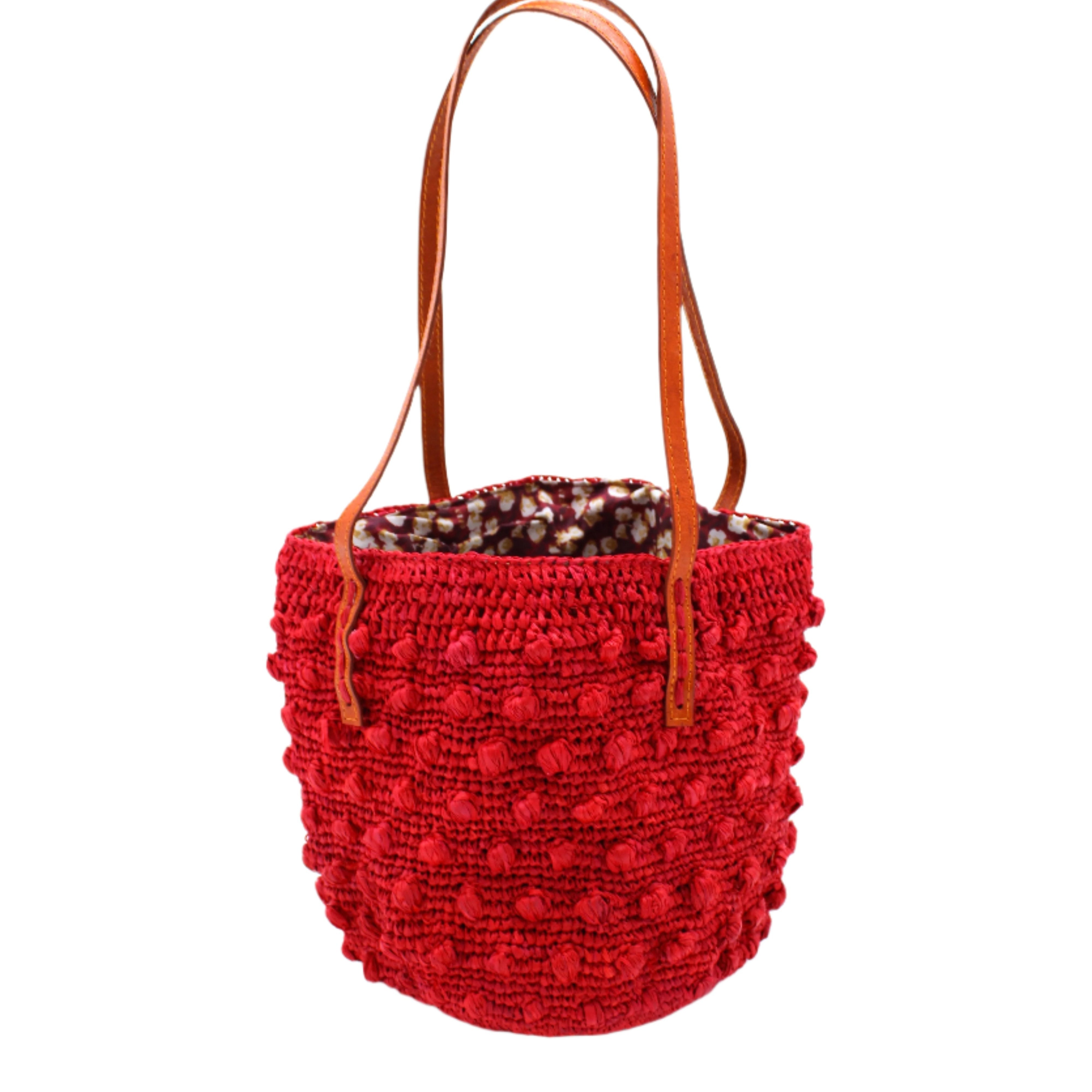 Boucle Red Crochet Small Straw Handbag handmade woven raffia palm fiber in a solid hue of red in a supple nub/ball texture of horizontal bands around the bag with link weave around the top plus assorted print drawstring liner and leather handles shoulder bag purse - Shebobo