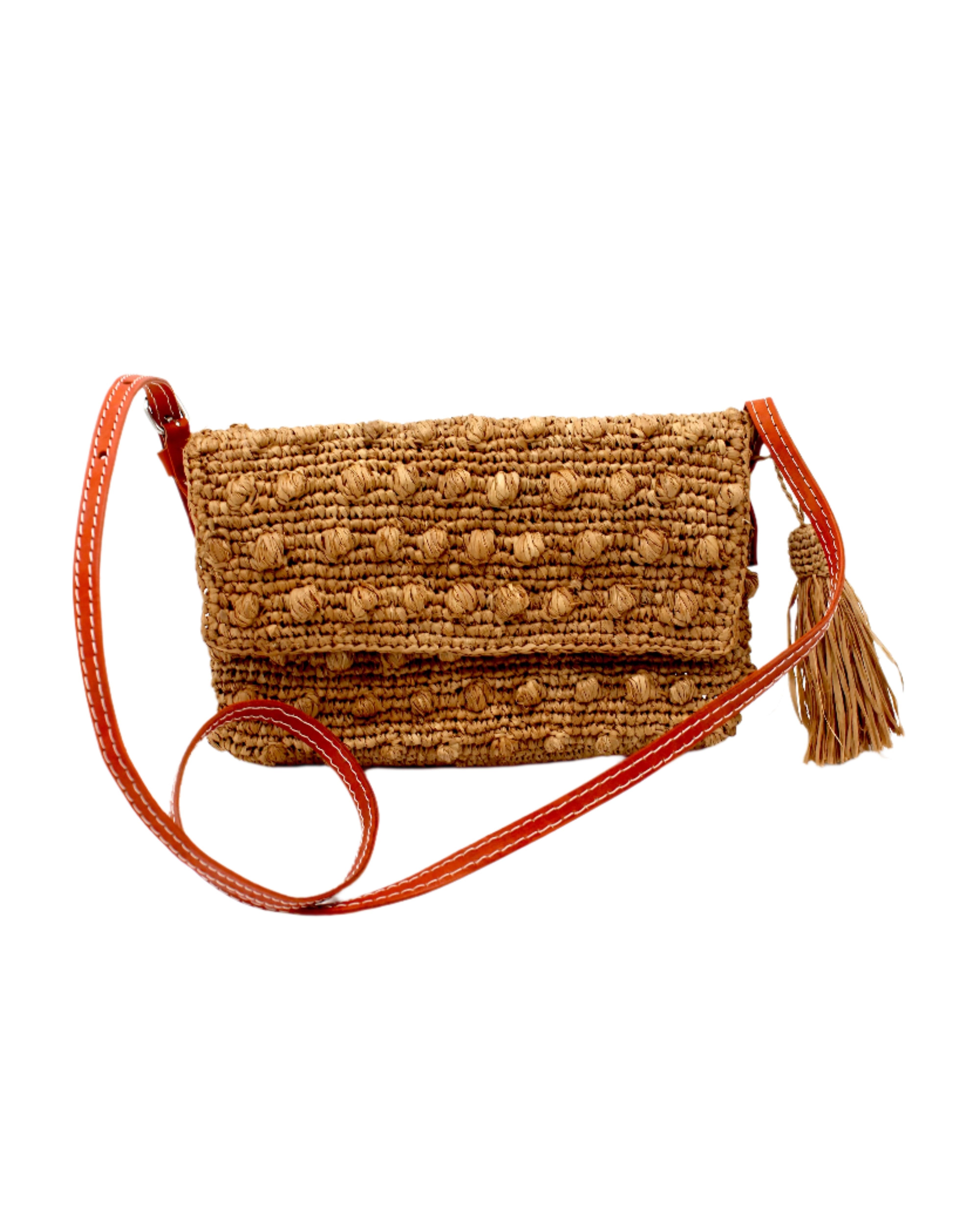 Boucle Cappuccino Crochet Straw Crossbody Bag with Tassel Charm handmade woven raffia palm fiber in a solid hue of cappuccino light/brown/beige in a supple nub/ball texture of horizontal bands around the bag with link weave around the outer envelope closure flap plus adjustable leather shoulder strap beach bag purse - Shebobo