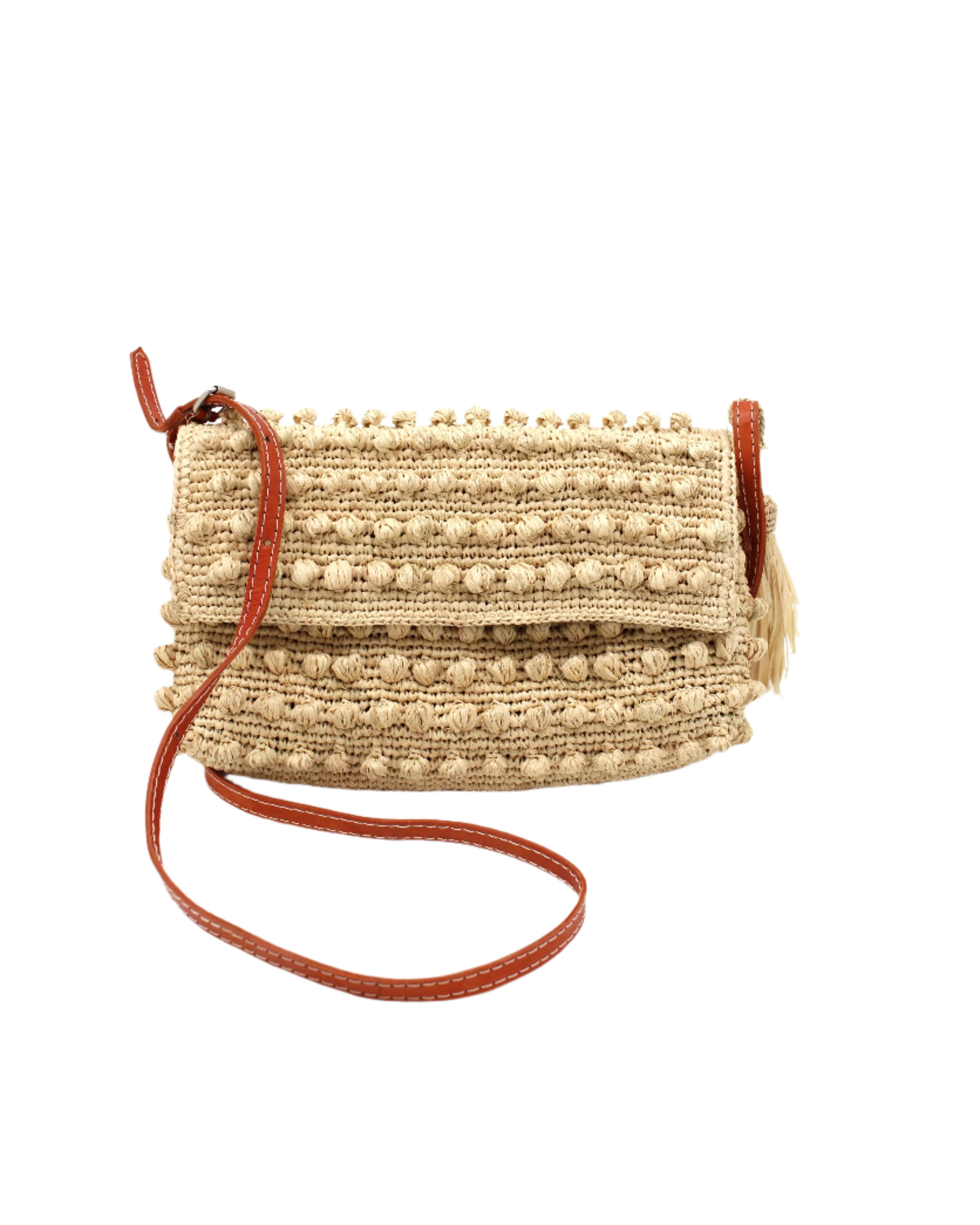 Boucle Natural Crochet Straw Crossbody Bag with Tassel Charm handmade woven raffia palm fiber in a solid hue of natural straw color in a supple nub/ball texture of horizontal bands around the bag with link weave around the outer envelope closure flap plus adjustable leather shoulder strap beach bag purse - Shebobo