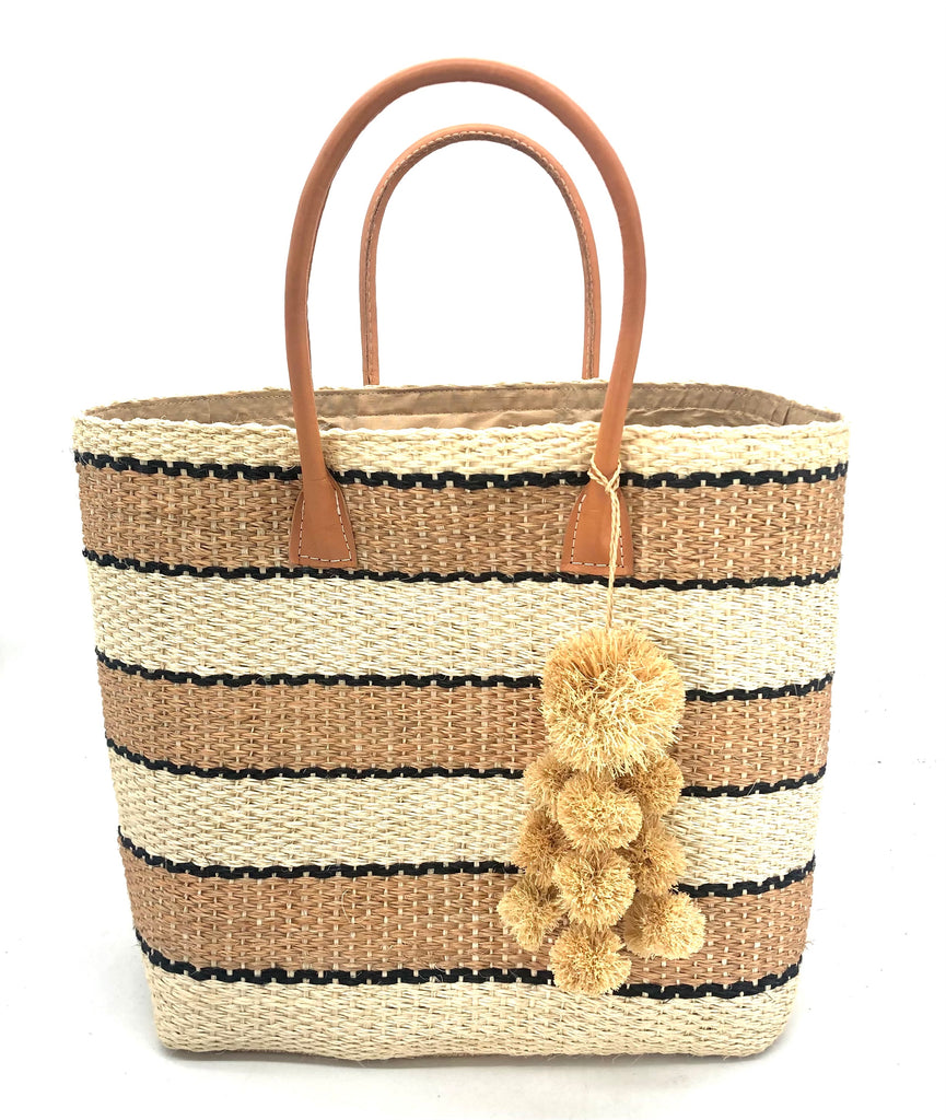 Cabrillo Cinnamon Multi Sisal Basket Bag with Waterfall Pompoms Charm Embellishment handmade woven natural sisal fiber in multiple widths of horizontal stripe bands of cinnamon/tobacco/brown, black, and natural straw color which make a stripe pattern handbag purse with leather handles - Shebobo