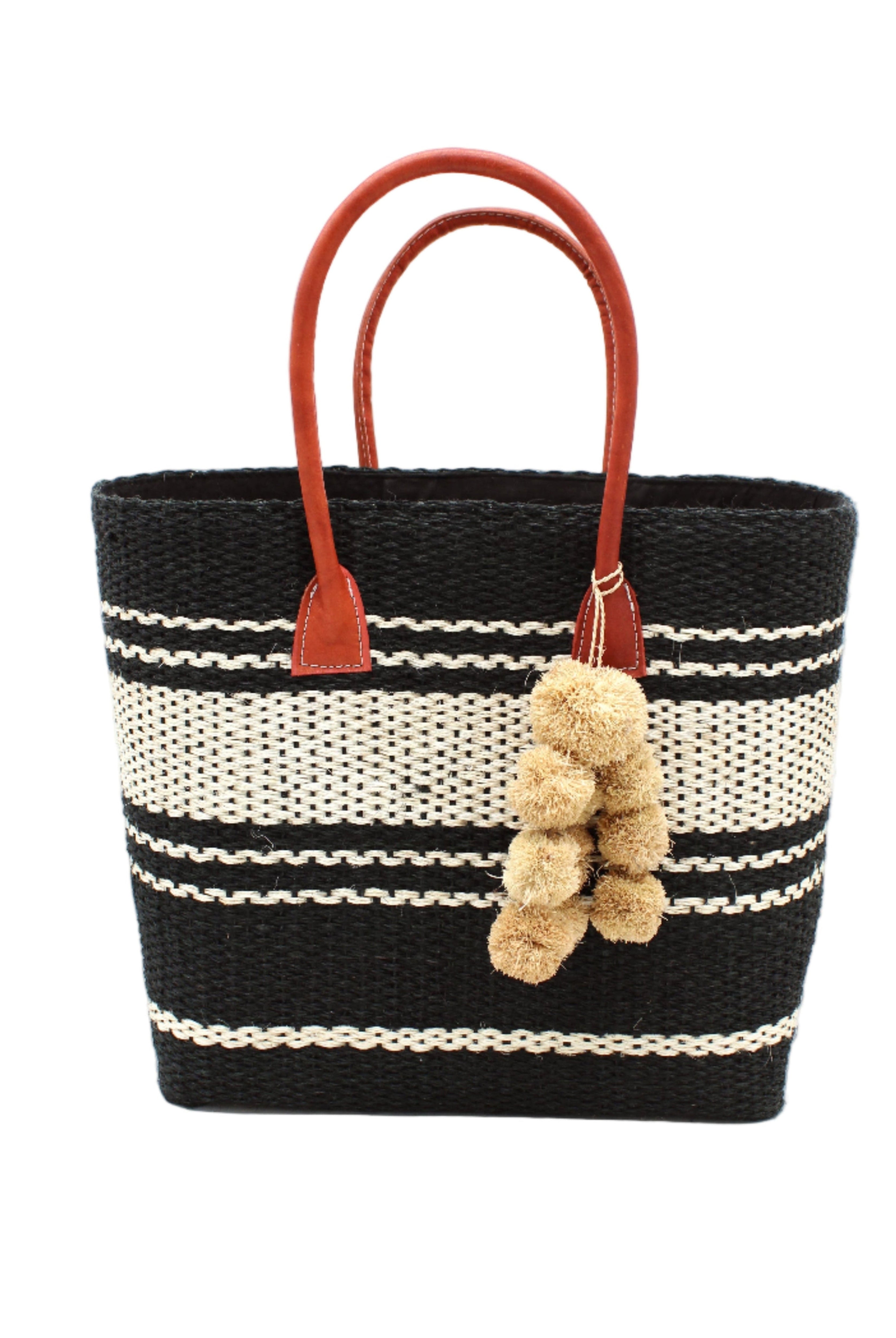 Cabrillo Sisal Basket Bag with Waterfall Pompoms Charm Embellishment handmade natural sisal fiber woven into a multicolor two tone Black and natural straw color horizontal stripe pattern with muti-width bands of color plus leather handles and natural raffia charm shoulder bag beach bag - Shebobo