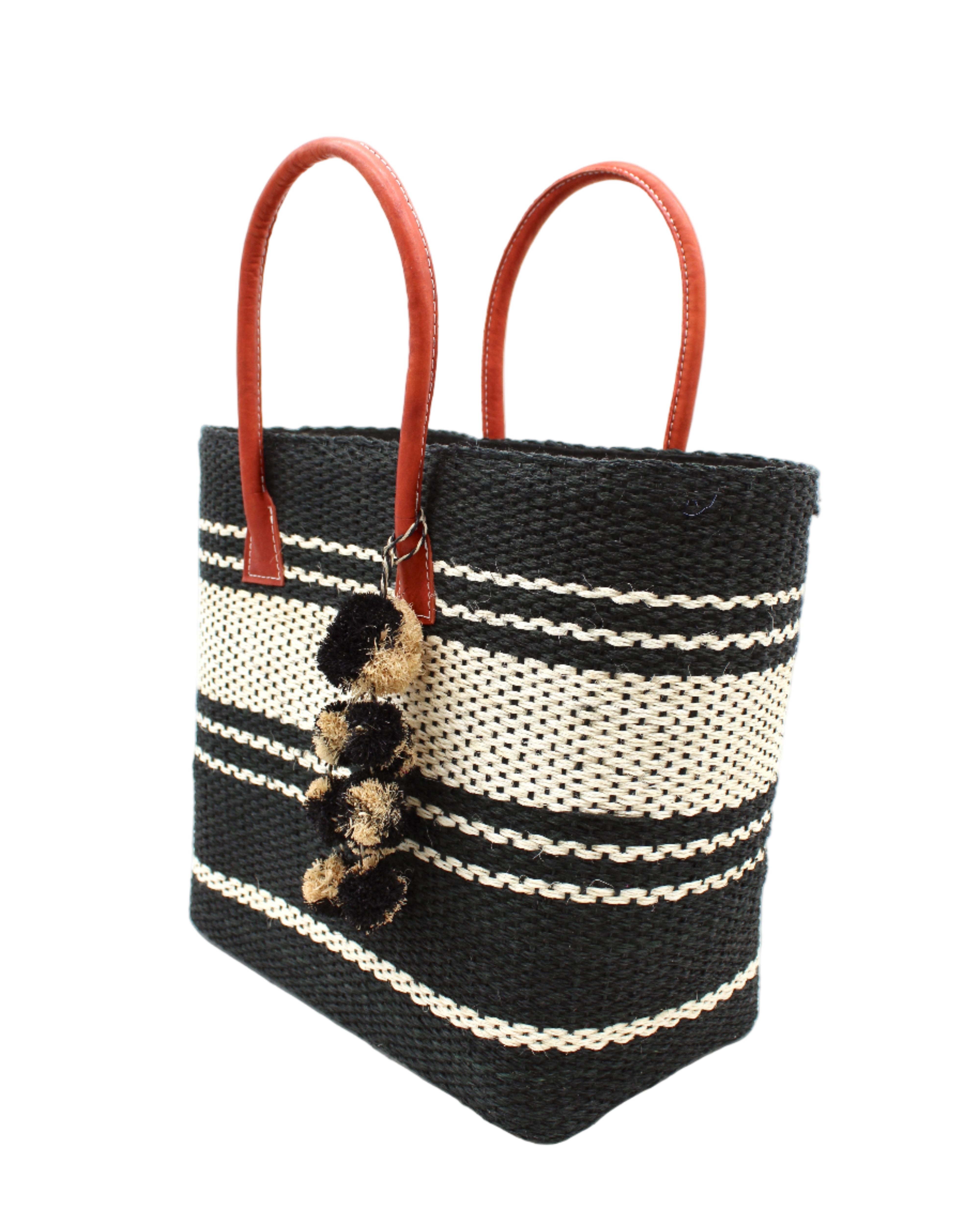 Side view Cabrillo Sisal Basket Bag with Waterfall Pompoms Charm Embellishment handmade natural sisal fiber woven into a multicolor two tone Black and natural straw color horizontal stripe pattern with muti-width bands of color plus leather handles and multicolor raffia charm shoulder bag beach bag - Shebobo