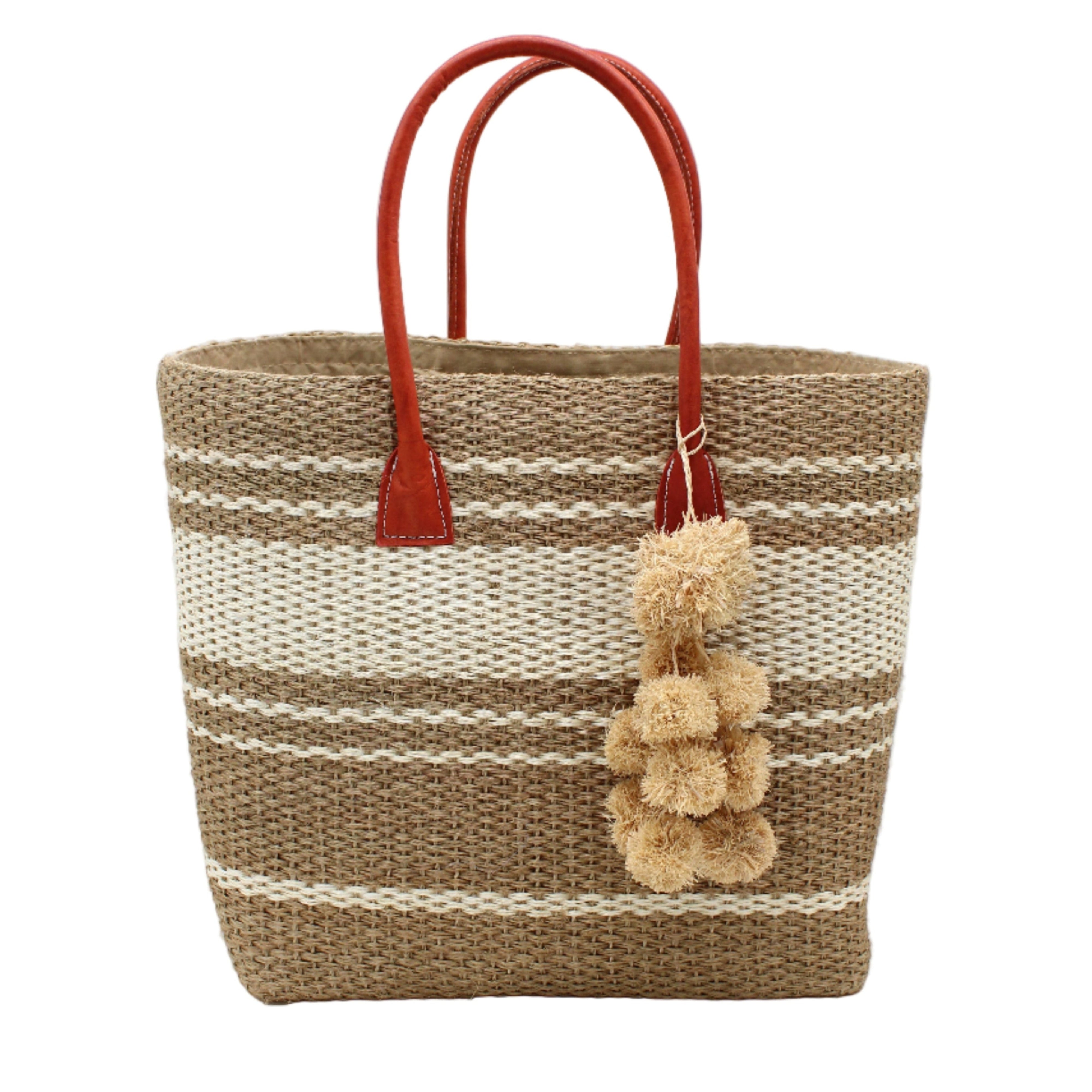 Cabrillo Sisal Basket Bag with Waterfall Pompoms Charm Embellishment handmade natural sisal fiber woven into a multicolor two tone Cappuccino tea/light/brown and natural straw color horizontal stripe pattern with muti-width bands of color plus leather handles and natural raffia charm shoulder bag beach bag - Shebobo