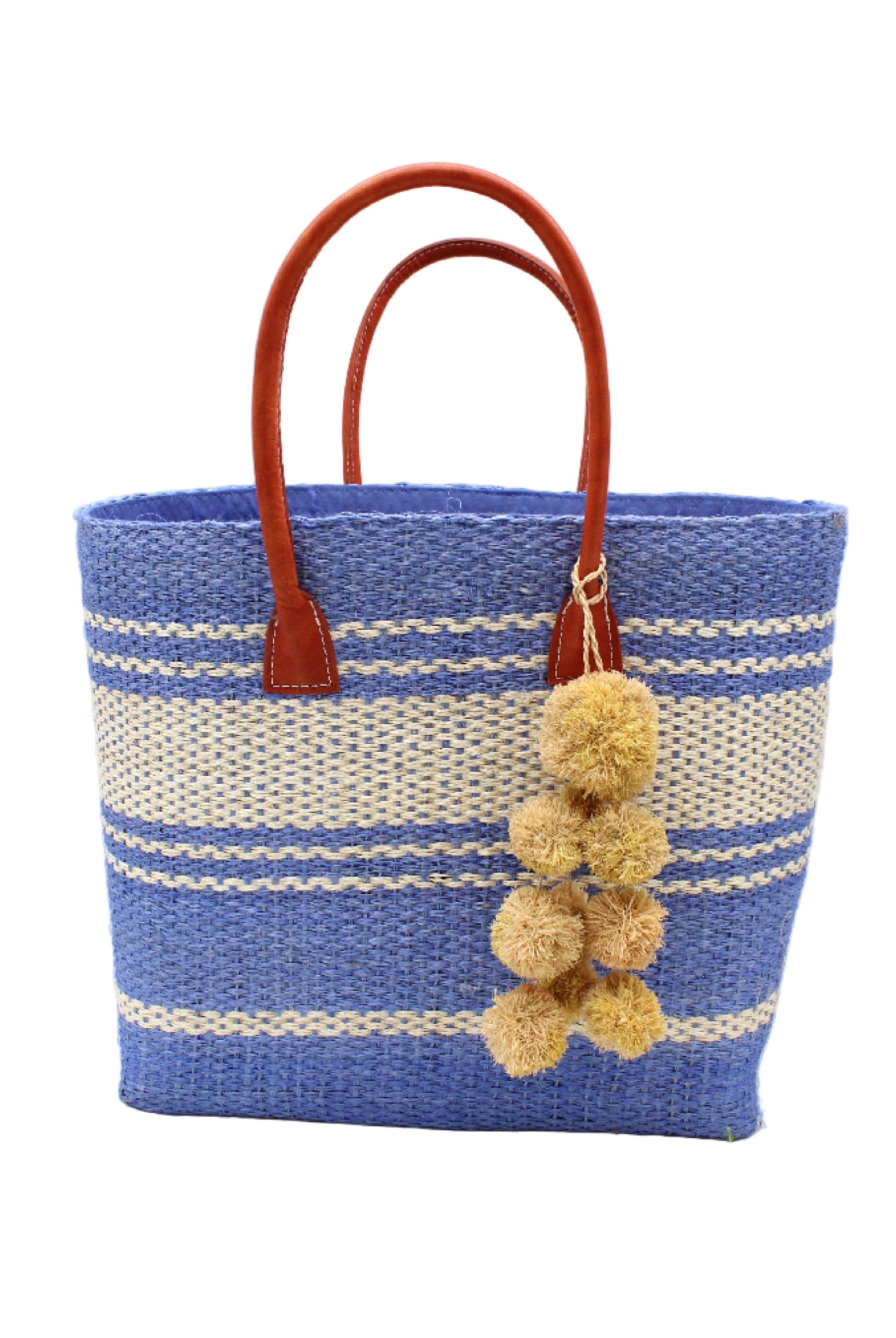 Cabrillo Sisal Basket Bag with Waterfall Pompoms Charm Embellishment handmade natural sisal fiber woven into a multicolor two tone Denim retro/light/blue and natural straw color horizontal stripe pattern with muti-width bands of color plus leather handles and natural raffia charm shoulder bag beach bag - Shebobo