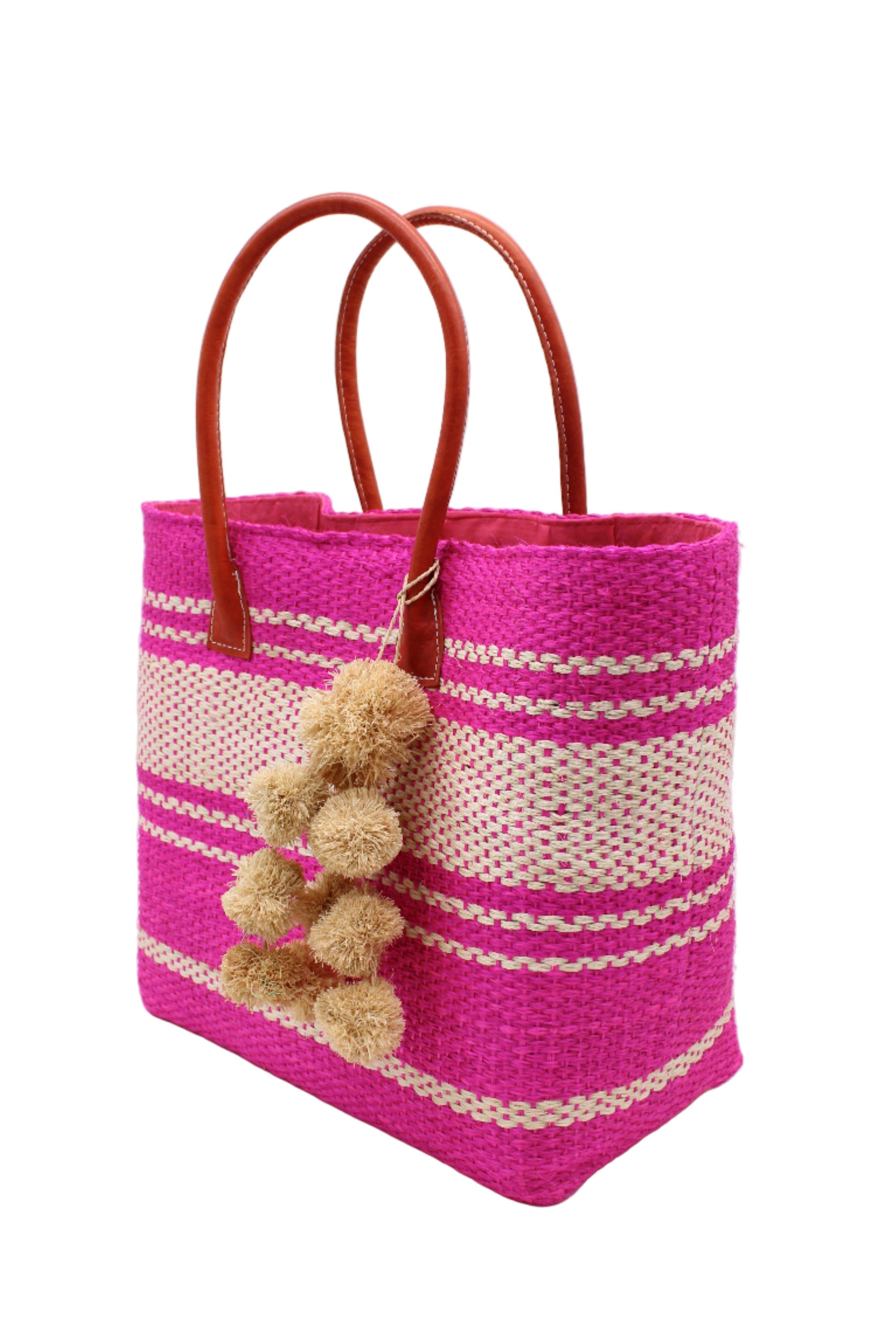 Side view Cabrillo Sisal Basket Bag with Waterfall Pompoms Charm Embellishment handmade natural sisal fiber woven into a multicolor two tone Fuchsia hot/bright/barbie/pink and natural straw color horizontal stripe pattern with muti-width bands of color plus leather handles and natural raffia charm shoulder bag beach bag - Shebobo