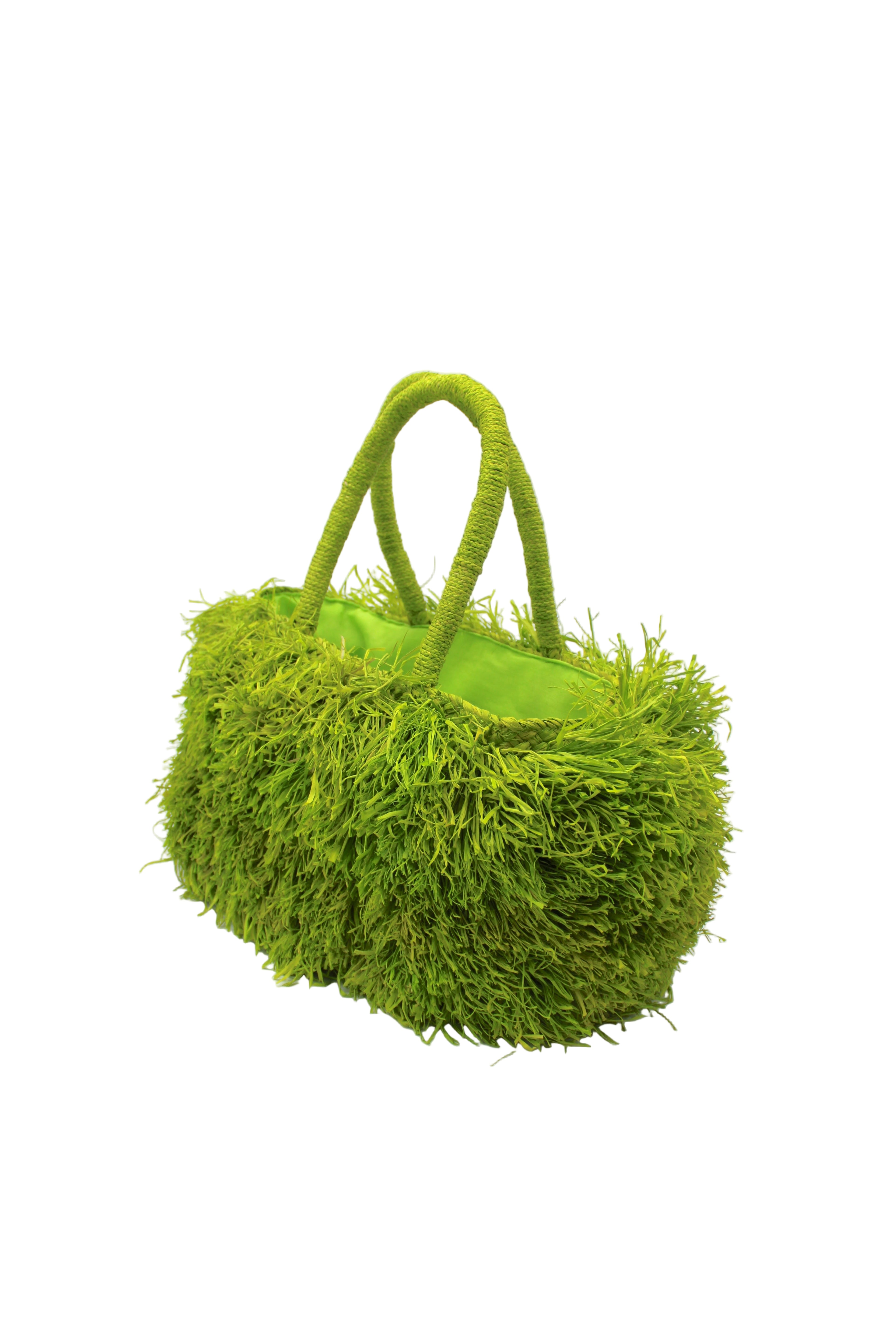 Side view Calypso Pompom Pouf Crochet Straw Basket Handbag handmade natural raffia palm fiber in a solid hue of Midori lime/bright/neon/green with brushed fringe strands crochet and knotted into a pouf texture with matching wrapped handles purse - Shebobo