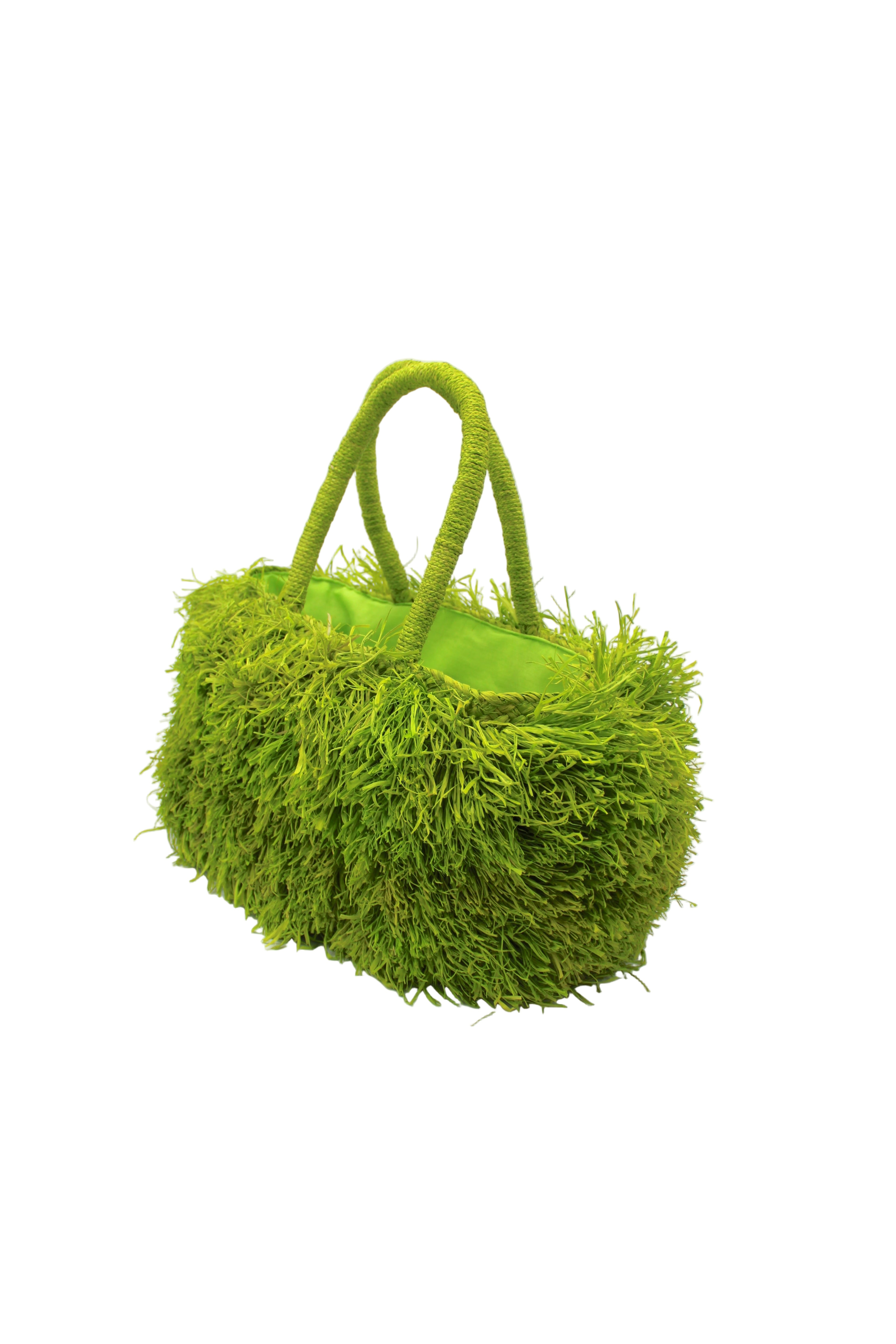 Side view Calypso Pompom Pouf Crochet Straw Basket Handbag handmade natural raffia palm fiber in a solid hue of Midori lime/bright/neon/green with brushed fringe strands crochet and knotted into a pouf texture with matching wrapped handles purse - Shebobo