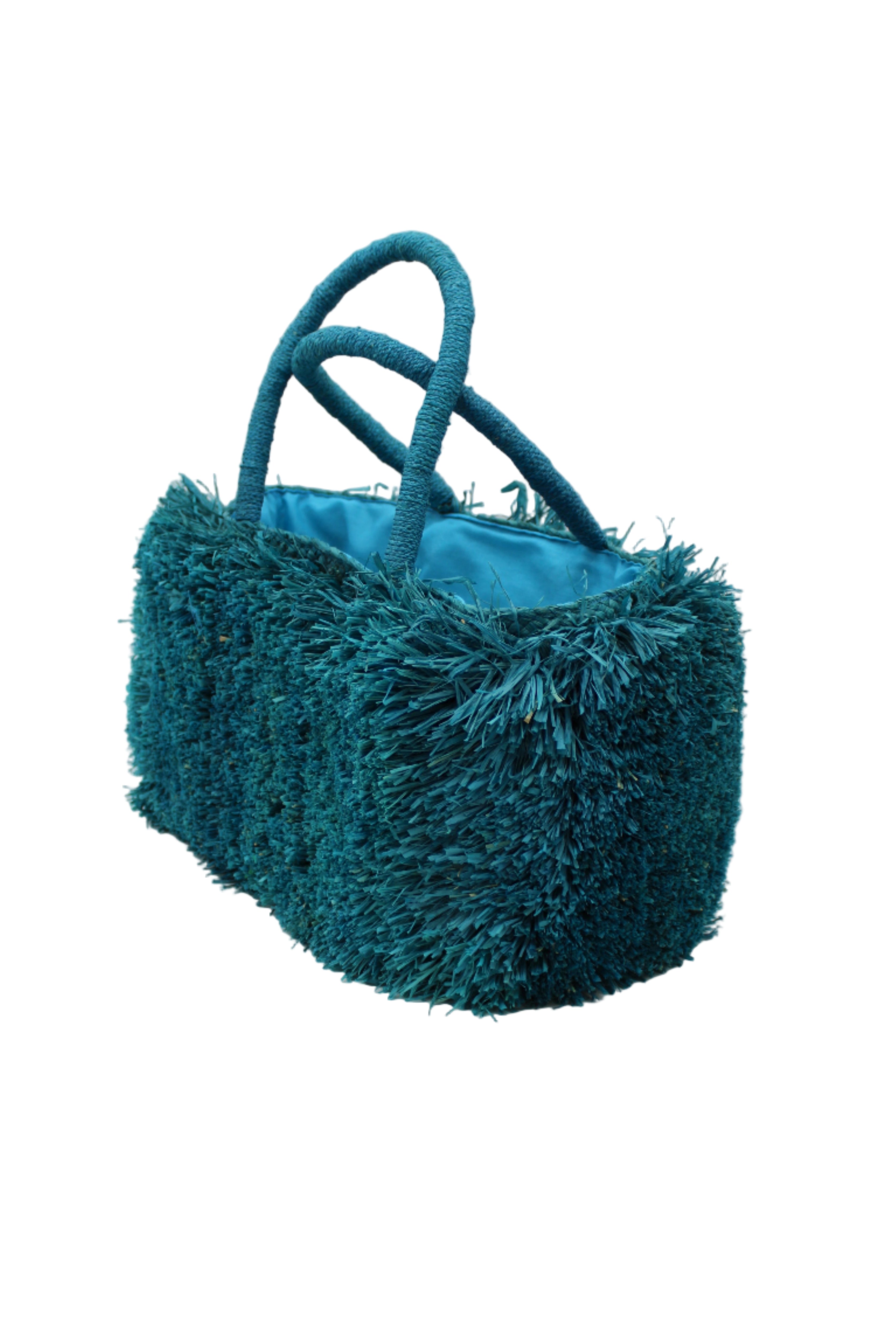 Side view Calypso Pompom Pouf Crochet Straw Basket Handbag handmade natural raffia palm fiber in a solid hue of Turquoise blue/green with brushed fringe strands crochet and knotted into a pouf texture with matching wrapped handles purse - Shebobo