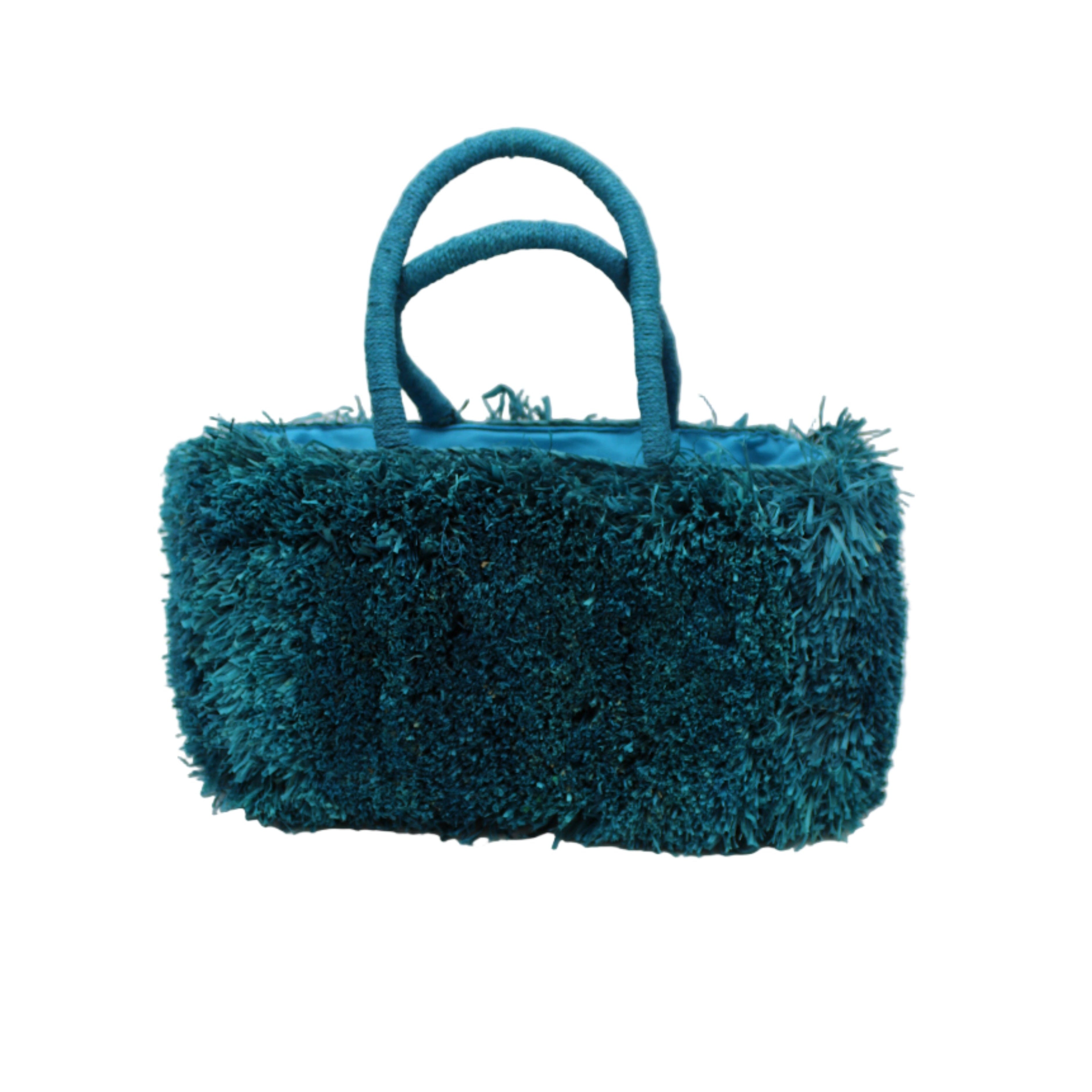 Calypso Pompom Pouf Crochet Straw Basket Handbag handmade natural raffia palm fiber in a solid hue of Turquoise blue/green with brushed fringe strands crochet and knotted into a pouf texture with matching wrapped handles purse - Shebobo