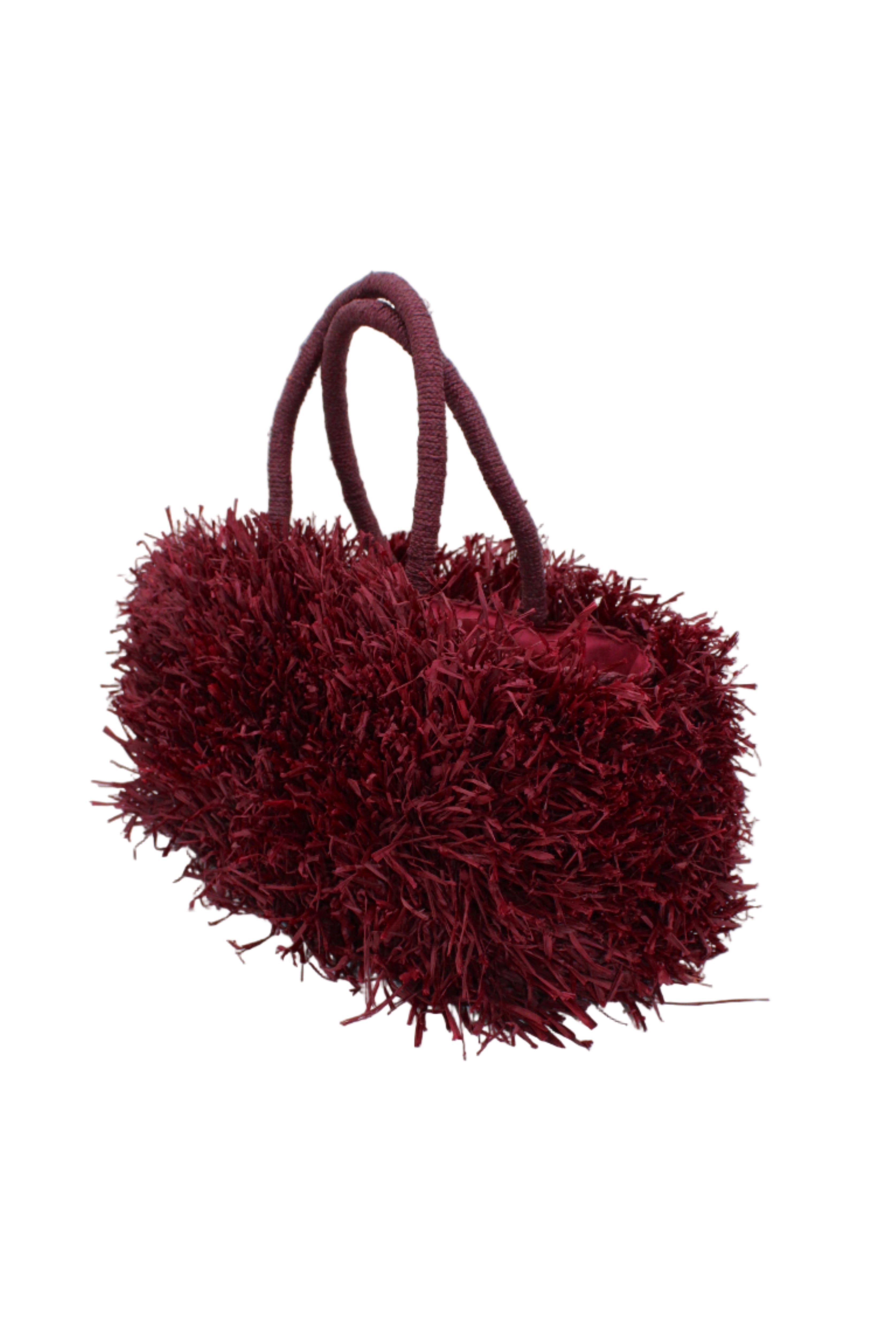 Side view Calypso Pompom Pouf Crochet Straw Basket Handbag handmade natural raffia palm fiber in a solid hue of Umberwine burgunday/bordeaux/dark/purple/red with brushed fringe strands crochet and knotted into a pouf texture with matching wrapped handles purse - Shebobo
