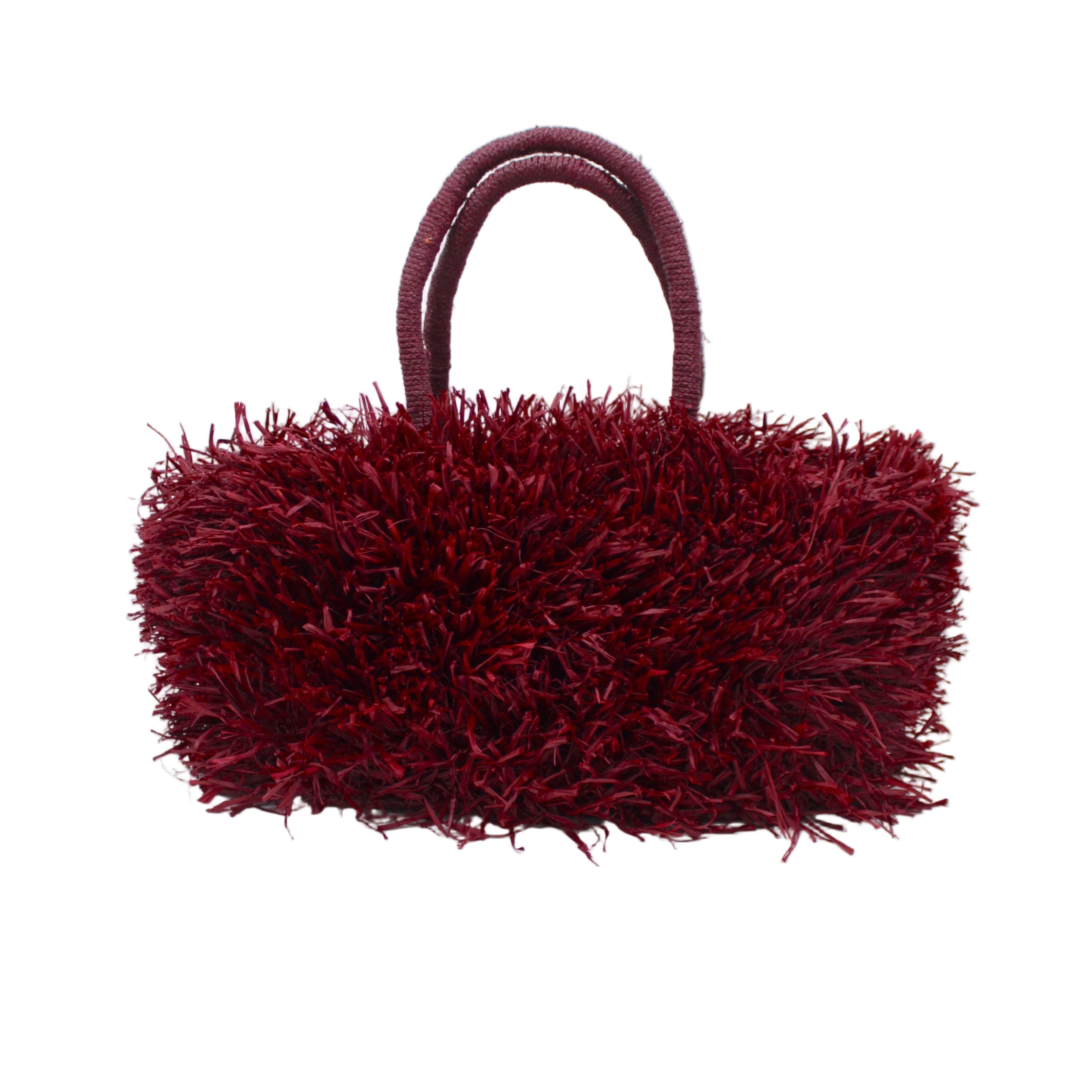 Calypso Pompom Pouf Crochet Straw Basket Handbag handmade natural raffia palm fiber in a solid hue of Umberwine burgunday/bordeaux/dark/purple/red with brushed fringe strands crochet and knotted into a pouf texture with matching wrapped handles purse - Shebobo