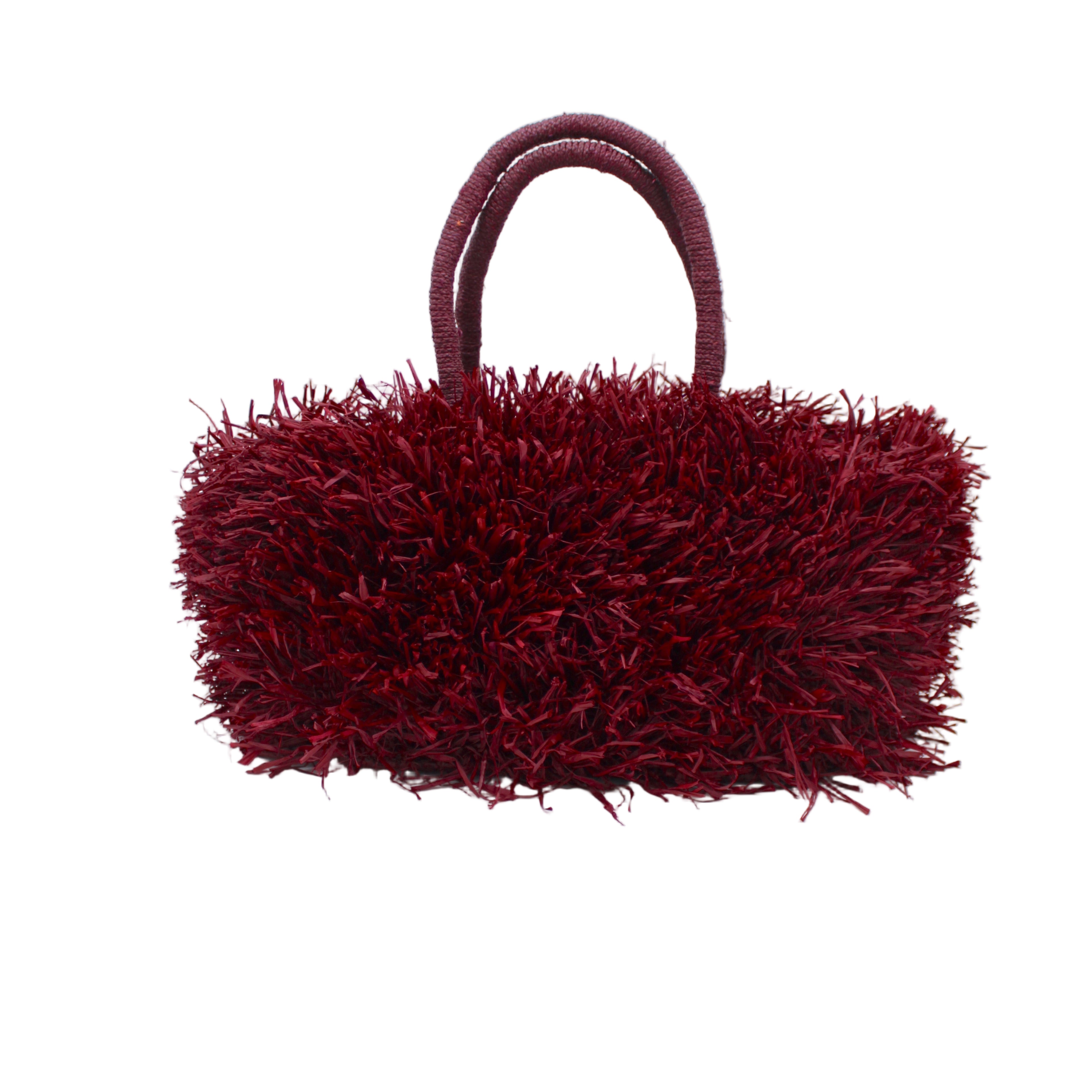 Calypso Pompom Pouf Crochet Straw Basket Handbag handmade natural raffia palm fiber in a solid hue of Umberwine burgunday/bordeaux/dark/purple/red with brushed fringe strands crochet and knotted into a pouf texture with matching wrapped handles purse - Shebobo