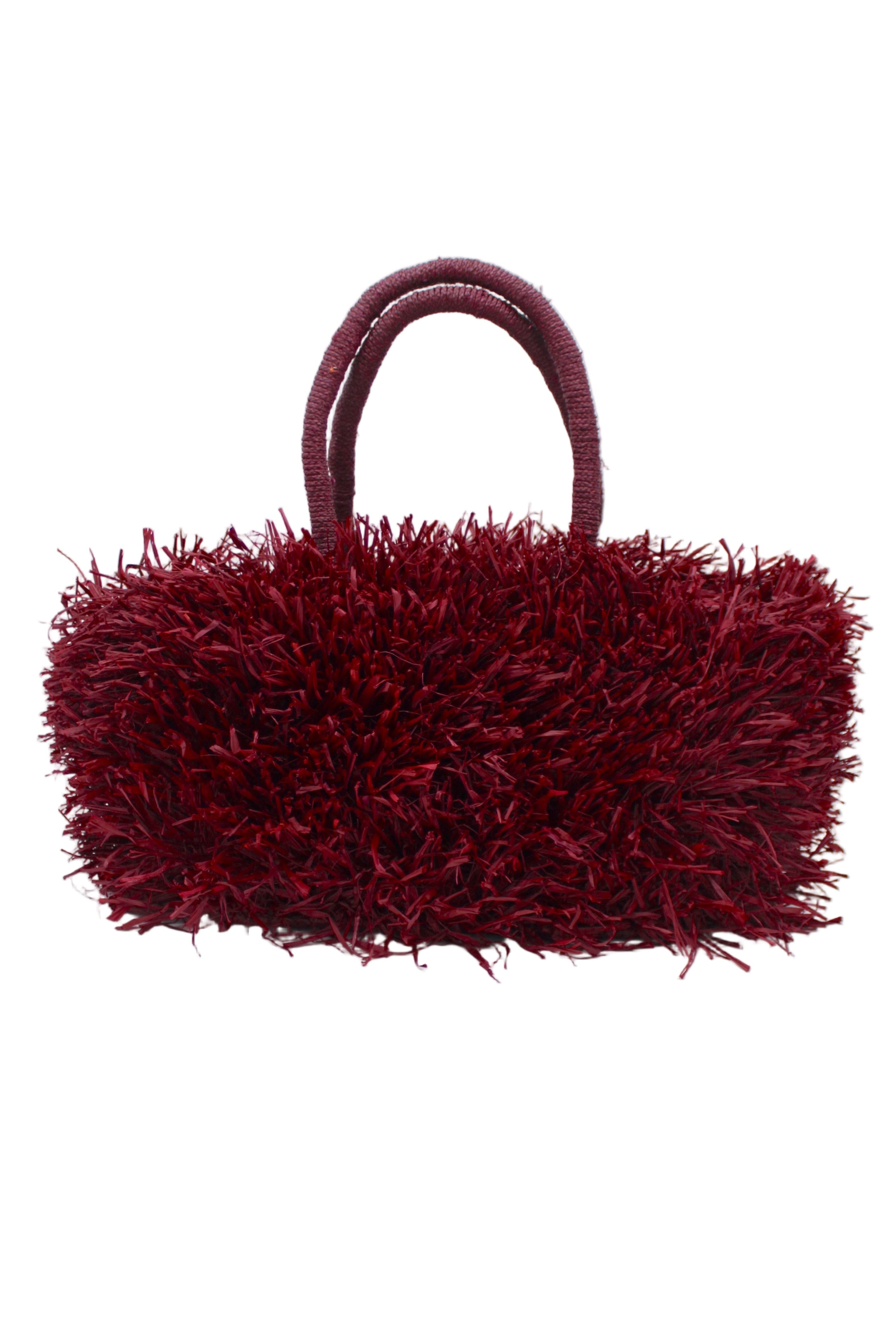 Calypso Pompom Pouf Crochet Straw Basket Handbag handmade natural raffia palm fiber in a solid hue of Umberwine burgunday/bordeaux/dark/purple/red with brushed fringe strands crochet and knotted into a pouf texture with matching wrapped handles purse - Shebobo