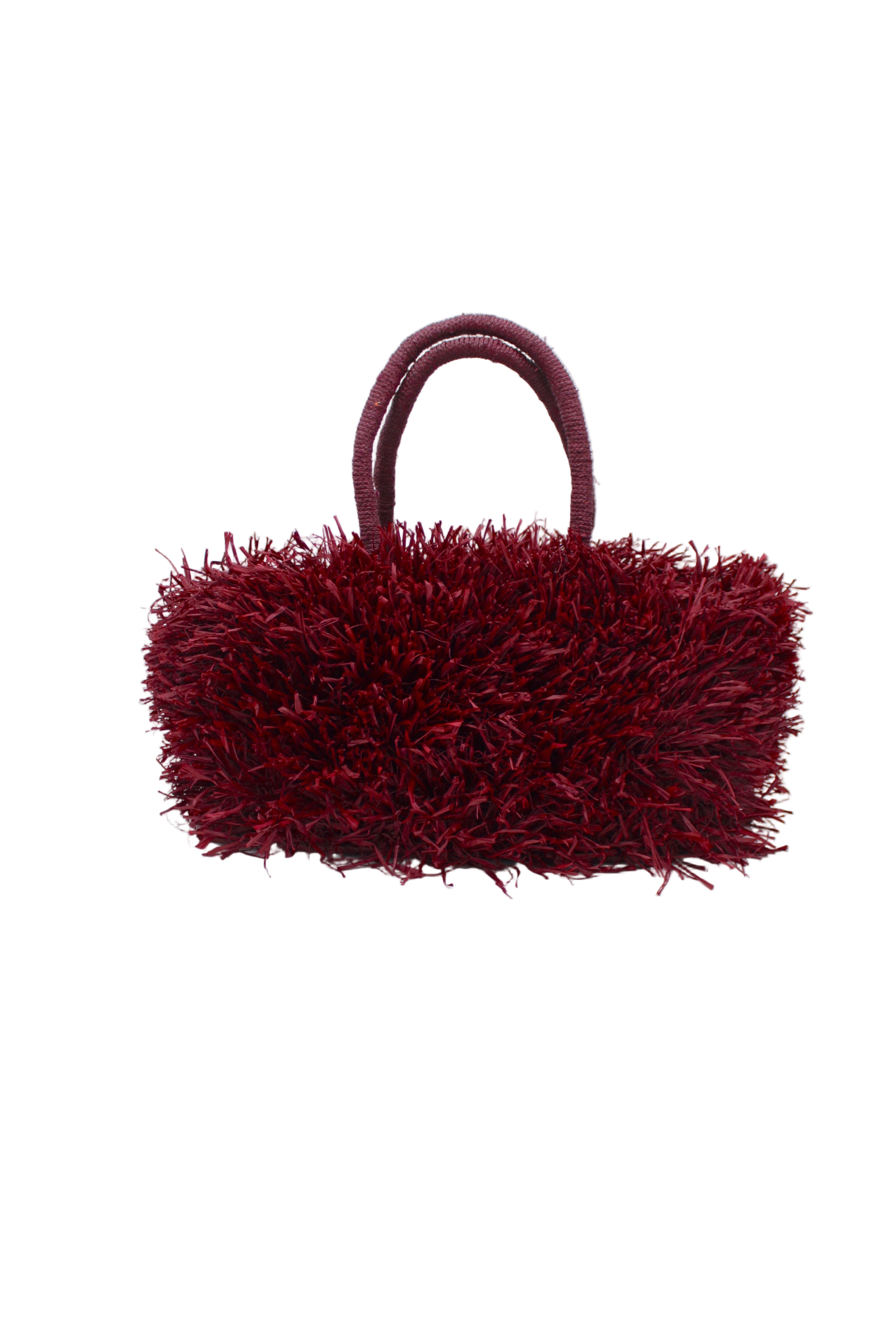 Calypso Pompom Pouf Crochet Straw Basket Handbag handmade natural raffia palm fiber in a solid hue of Umberwine burgunday/bordeaux/dark/purple/red with brushed fringe strands crochet and knotted into a pouf texture with matching wrapped handles purse - Shebobo
