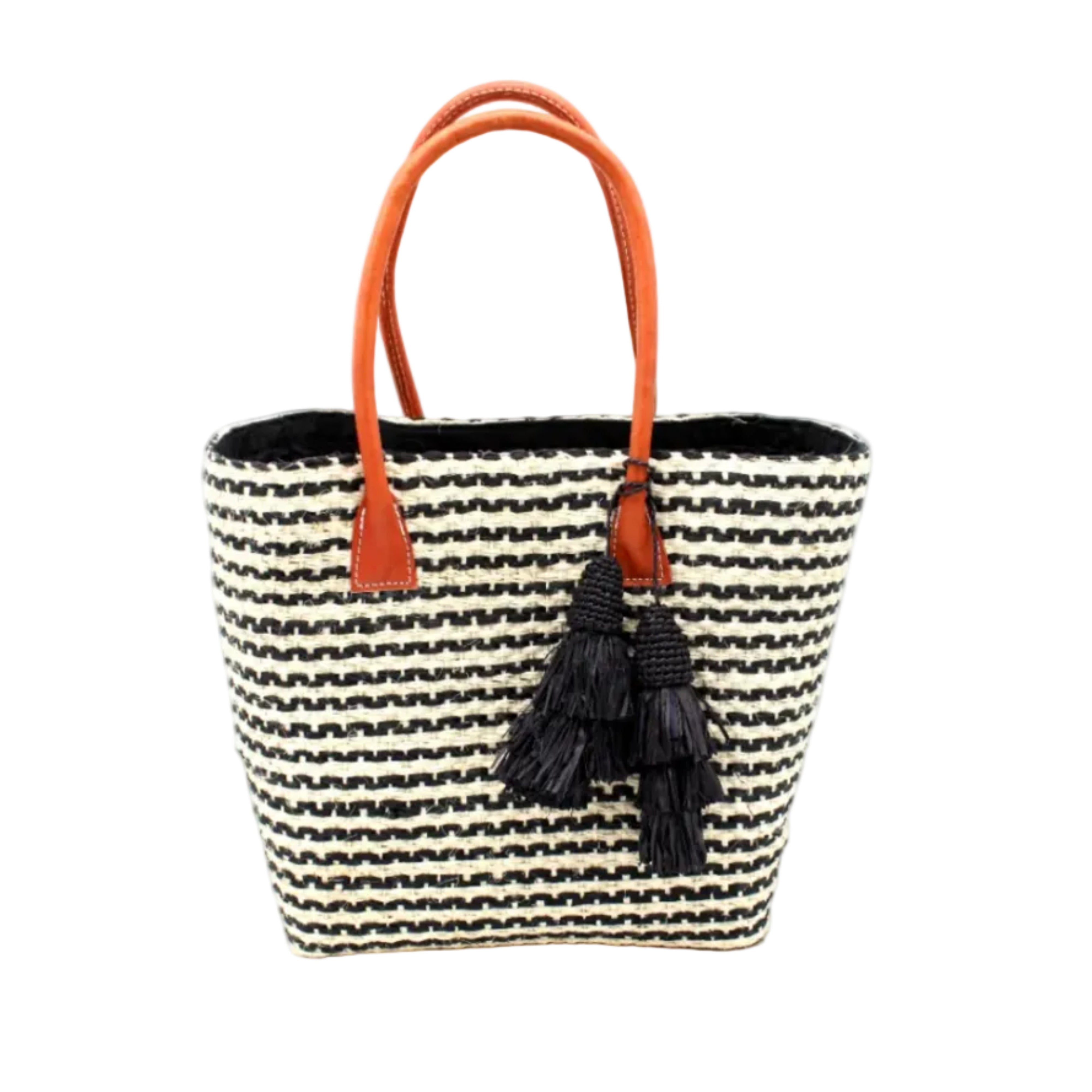 Cancun Small Sisal Basket Bag with Tassel Charm handmade natural sisal fibers woven into even width horizontal bands of black and natural straw color that create a pinstripe pattern with matching knotted raffia tufts tassel charm embellishment and leather handles beach bag - Shebobo