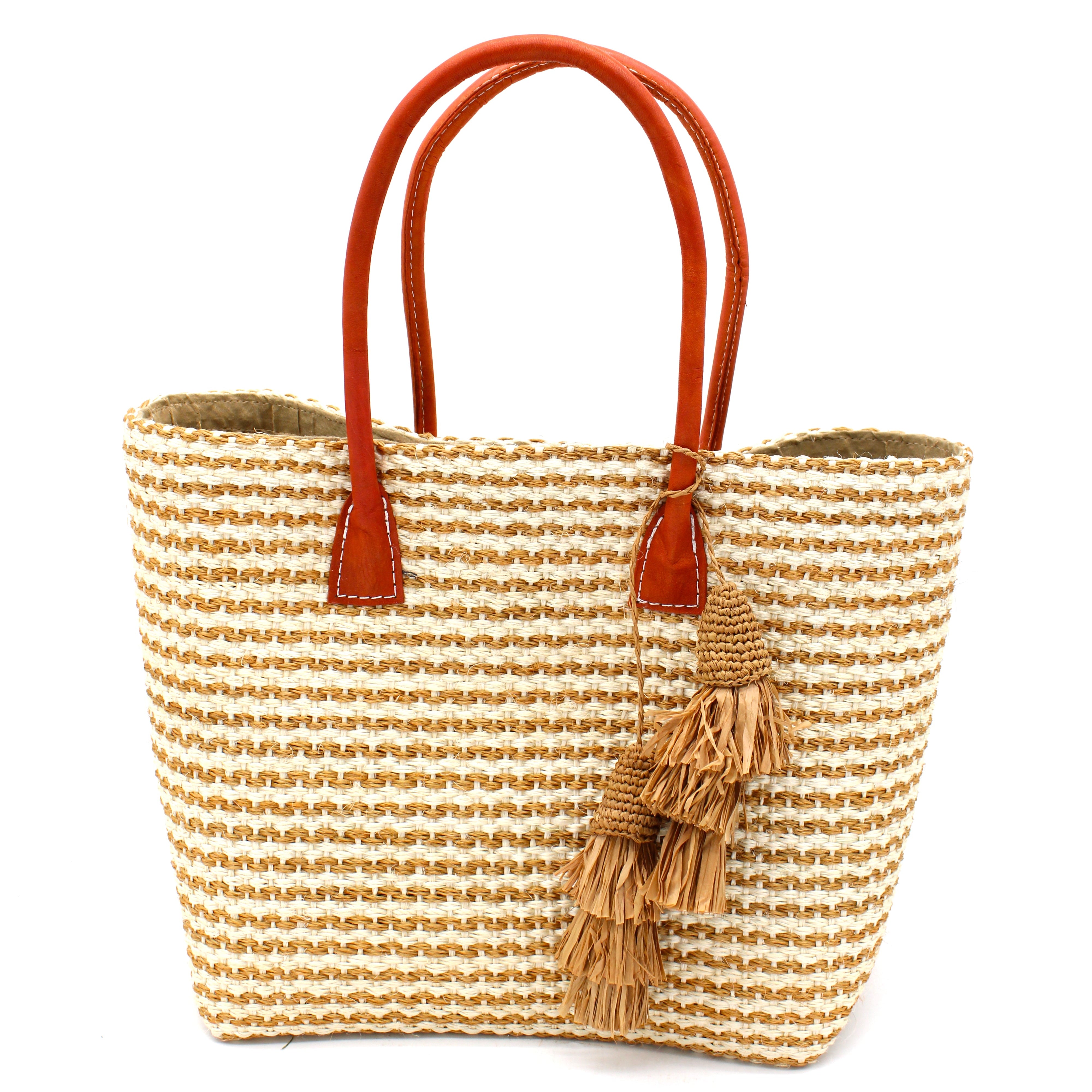 Cancun Small Sisal Basket Bag with Tassel Charm handmade natural sisal fibers woven into even width horizontal bands of cappuccino light brown and natural straw color that create a pinstripe pattern with matching knotted raffia tufts tassel charm embellishment and leather handles beach bag - Shebob